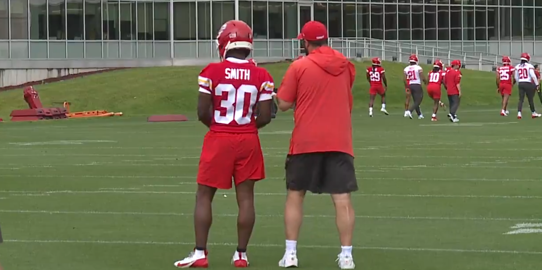 Chiefs assistant special teams coordinator Porter Ellett speaks to Brashard Smith during OTAs on Thursday, June 12.