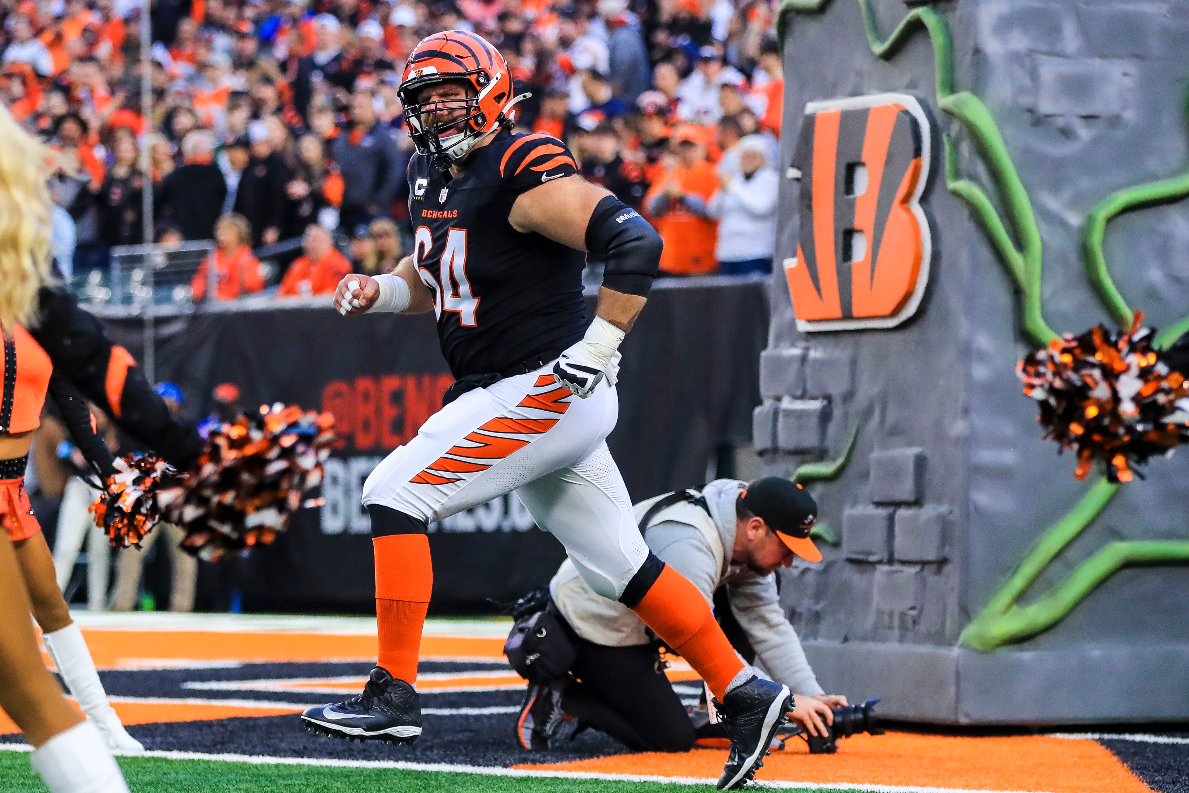 Dec 28, 2024; Cincinnati, Ohio, USA; Cincinnati Bengals center Ted Karras (64) runs onto the field before the game against the Denver Broncos at Paycor Stadium.