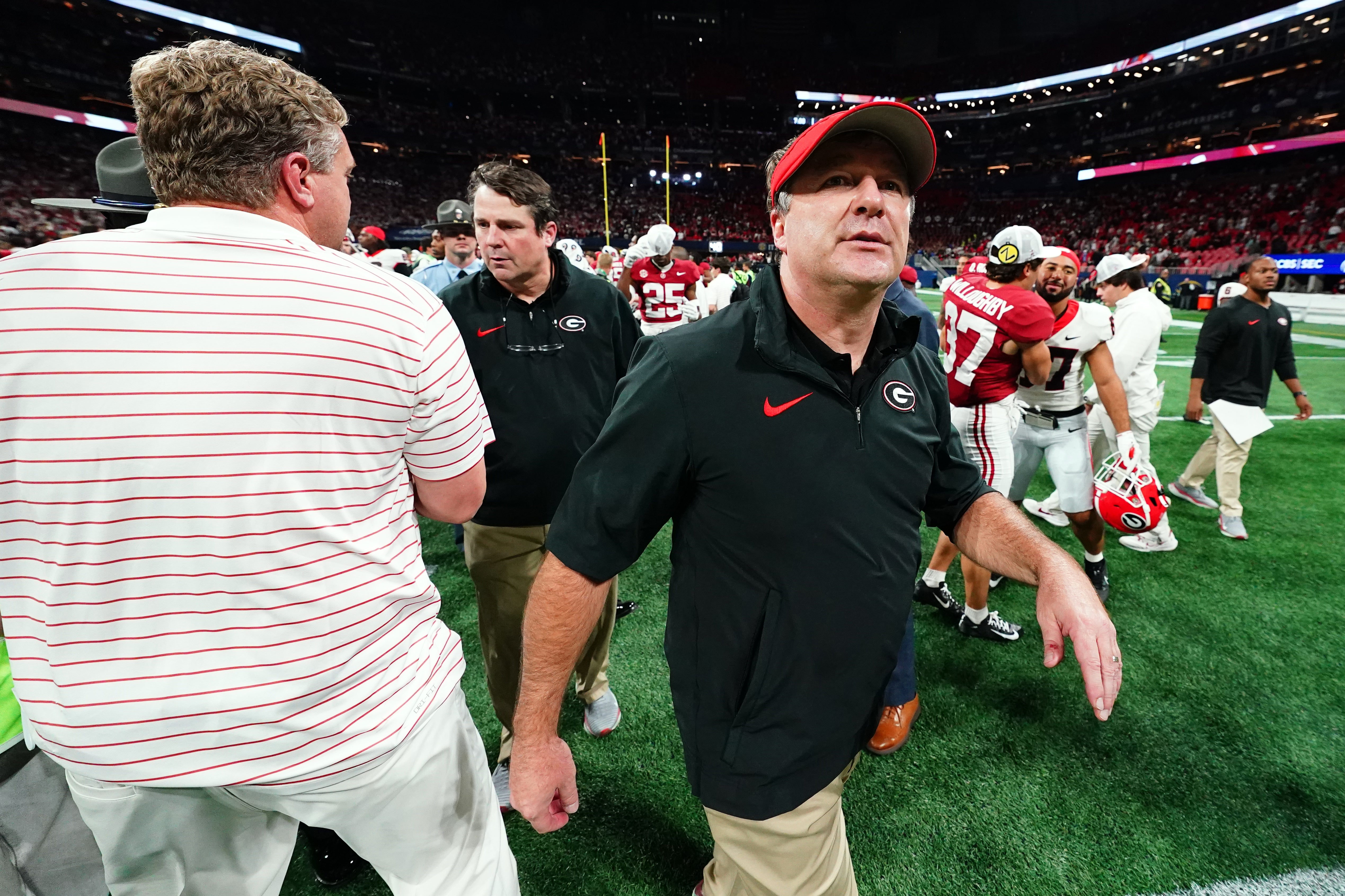 Georgia Bulldogs head coach Kirby Smart walks on field after the Alabama Crimson Tide defeated the Georgia Bulldogs in the SEC Championship at Mercedes-Benz Stadium.