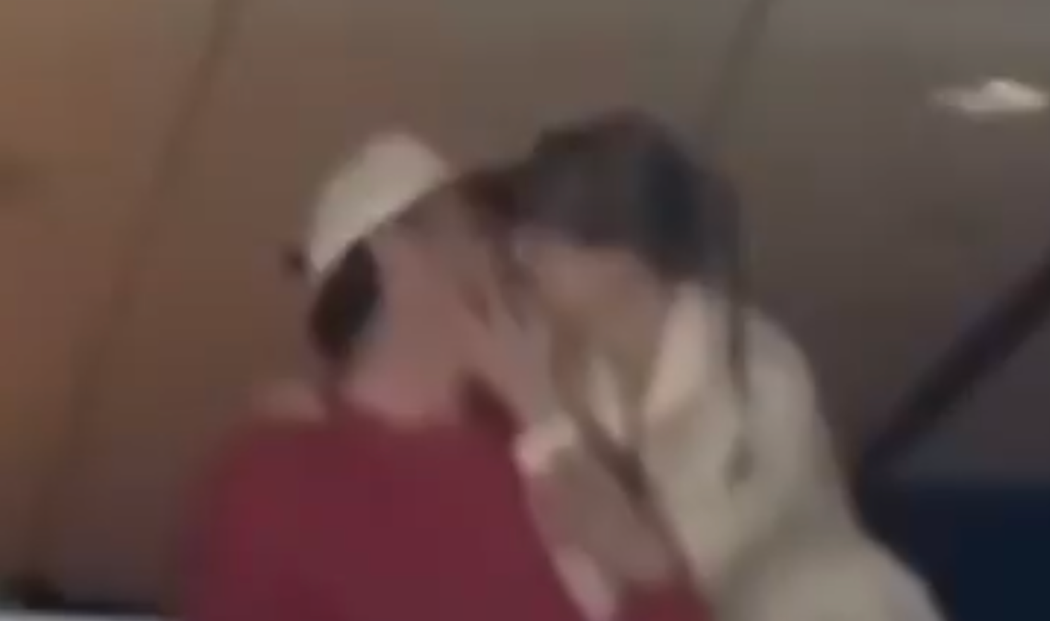 Taylor Swift and Travis Kelce share a kiss at Game 4 of the Stanley Cup Finals