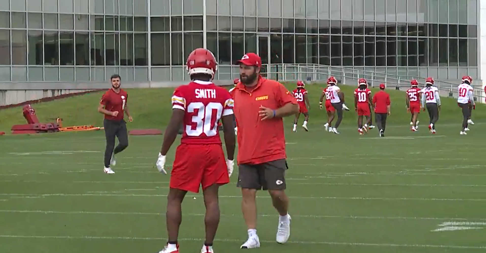 Chiefs assistant special teams coordinator Porter Ellett speaks to rookie RB Brashard Smith during OTAs on Thursday, June 12.