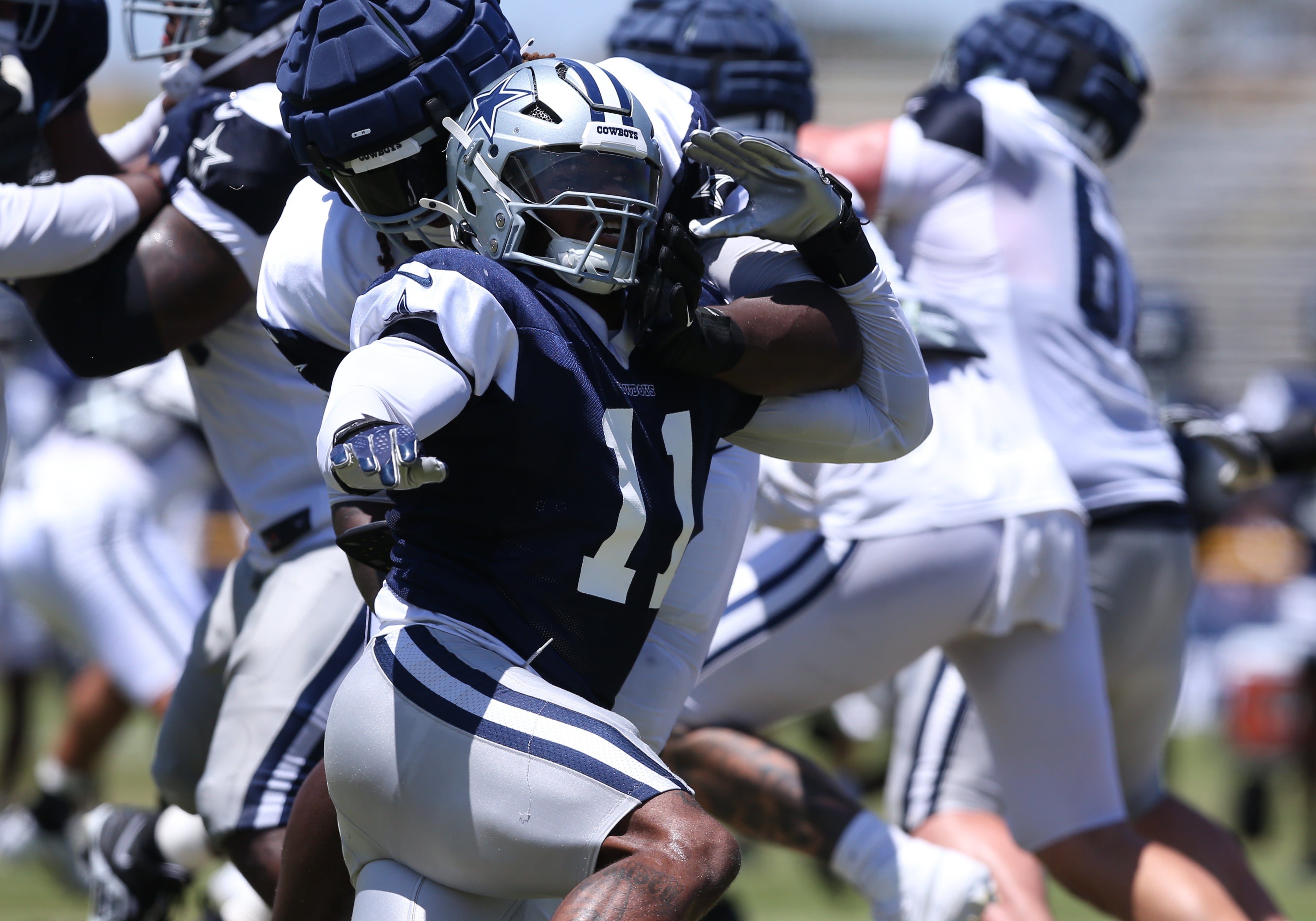 Dallas Cowboys linebacker Micah Parsons (11) rushes during training camp at the River Ridge Playing Fields in Oxnard, California.