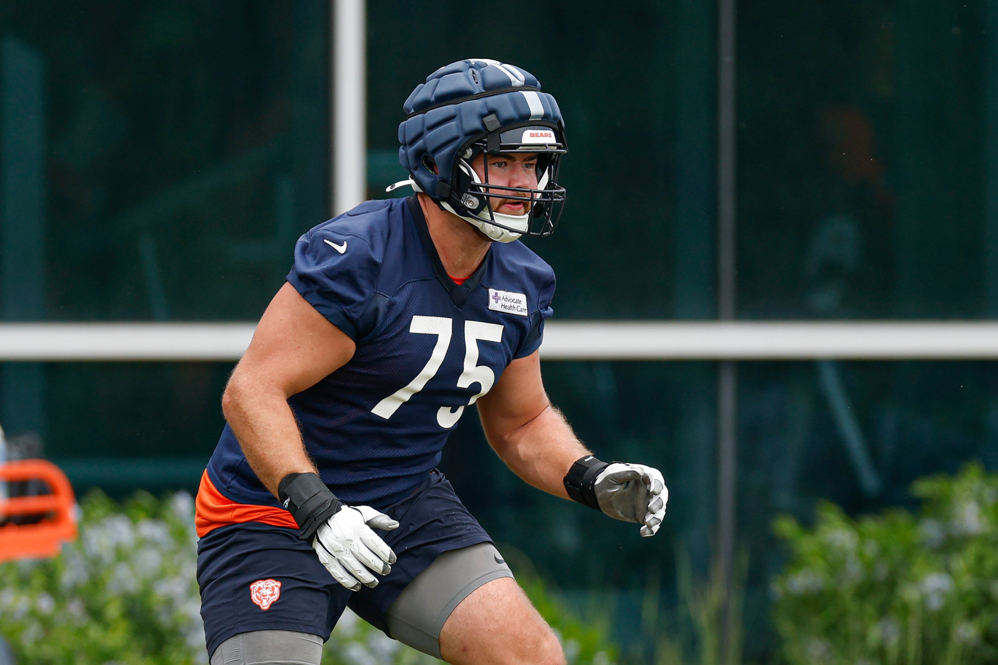 Jun 3, 2025; Lake Forest, IL, USA; Chicago Bears offensive tackle Ozzy Trapilo (75) warms up during minicamp at Halas Hall.