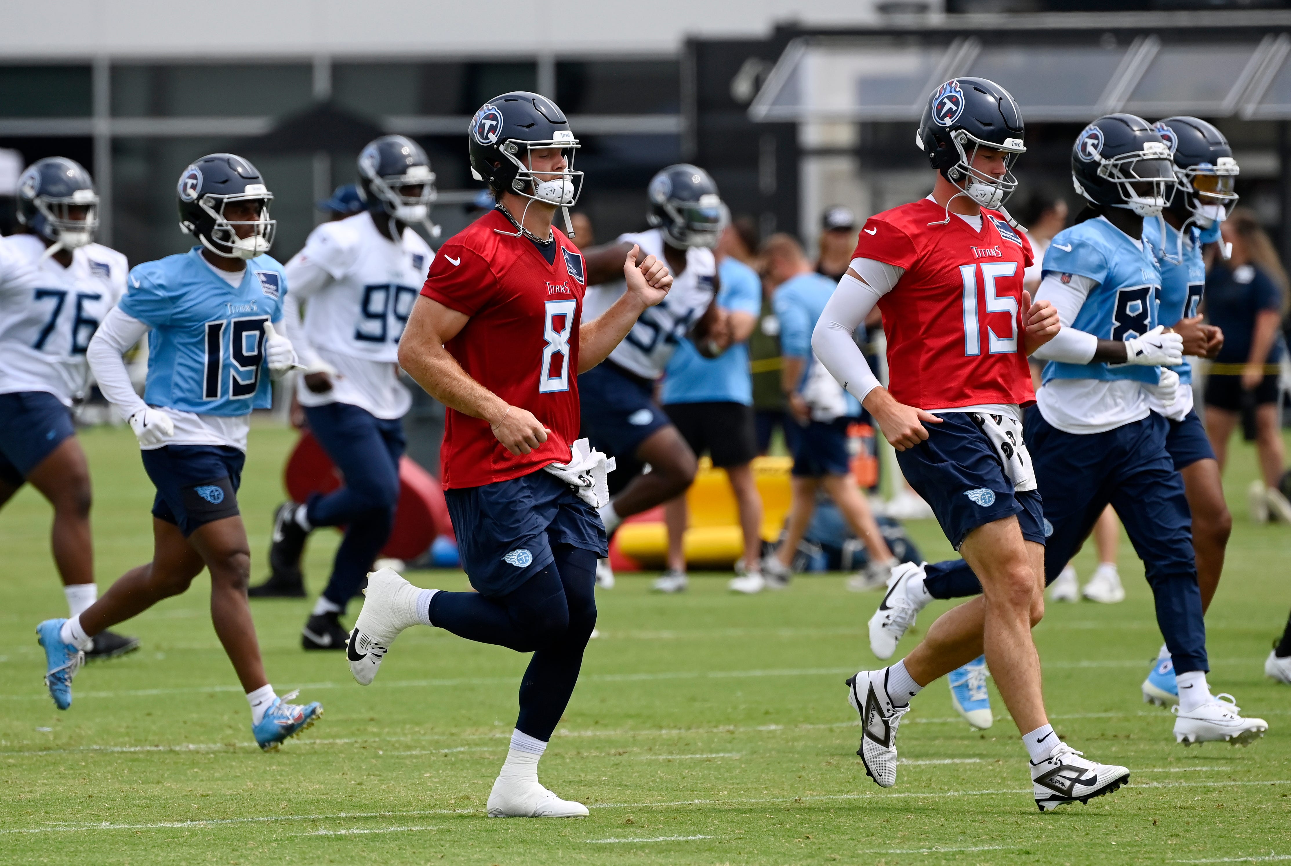Tennessee Titans quarterback’s Will Levis (8) and Tim Boyle (15) run during an NFL football minicamp camp practice at Ascension Saint Thomas Sports Park Thursday, June 12, 2025, in Nashville, Tenn.