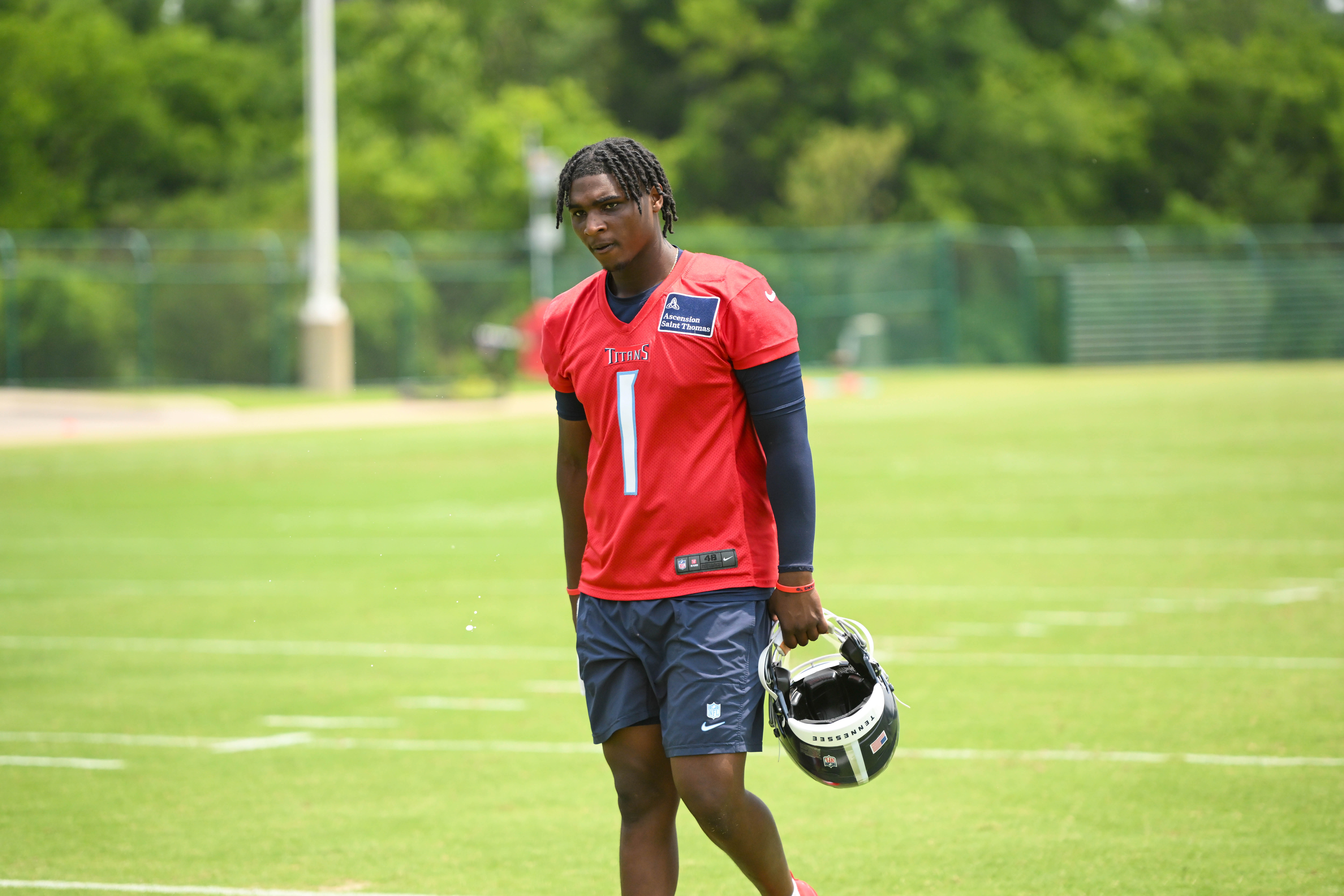 Jun 10, 2025; Nashville, TN, USA; Tennessee Titans quarterback Cam Ward (1) walks off the field during minicamp at Nissan Stadium. Mandatory Credit: Steve Roberts-Imagn Images