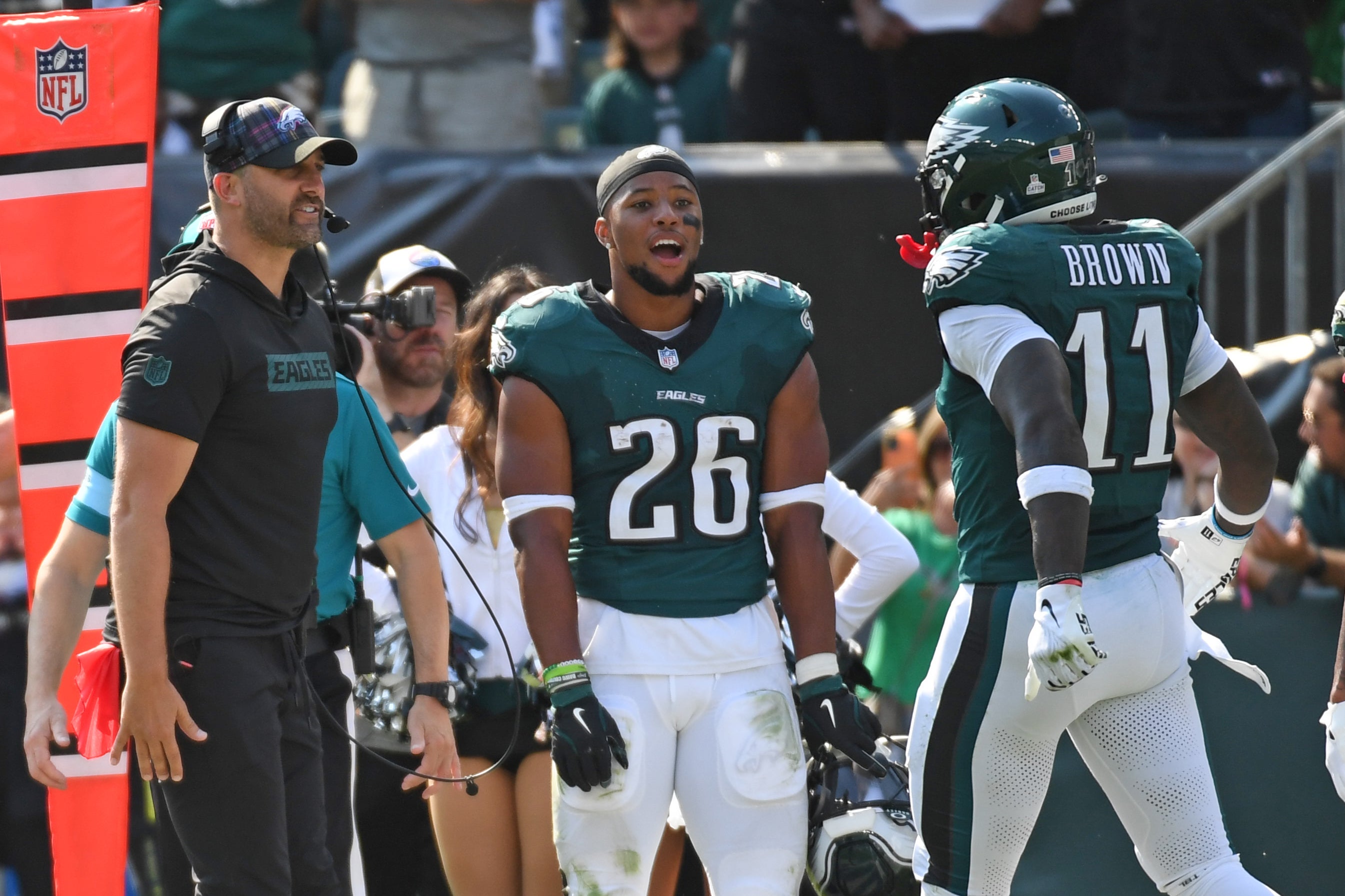 Philadelphia Eagles head coach Nick Sirianni and running back Saquon Barkley (26) celebrate touchdown catch by wide receiver A.J. Brown (11) against the Cleveland Browns during the second quarter.