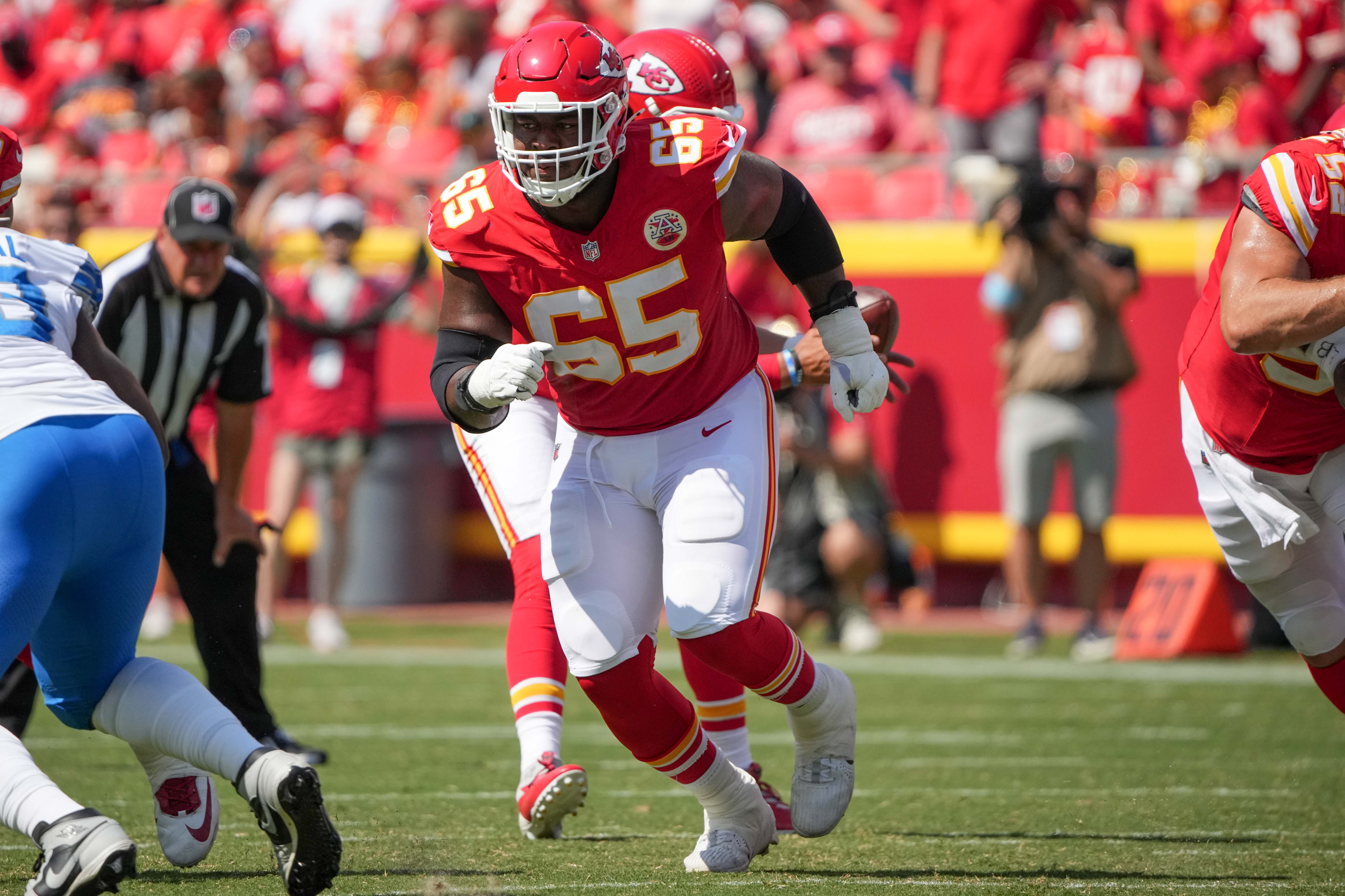 Aug 17, 2024; Kansas City, Missouri, USA; Kansas City Chiefs guard Trey Smith (65) prepares to block against the Detroit Lions during the game at GEHA Field at Arrowhead Stadium.