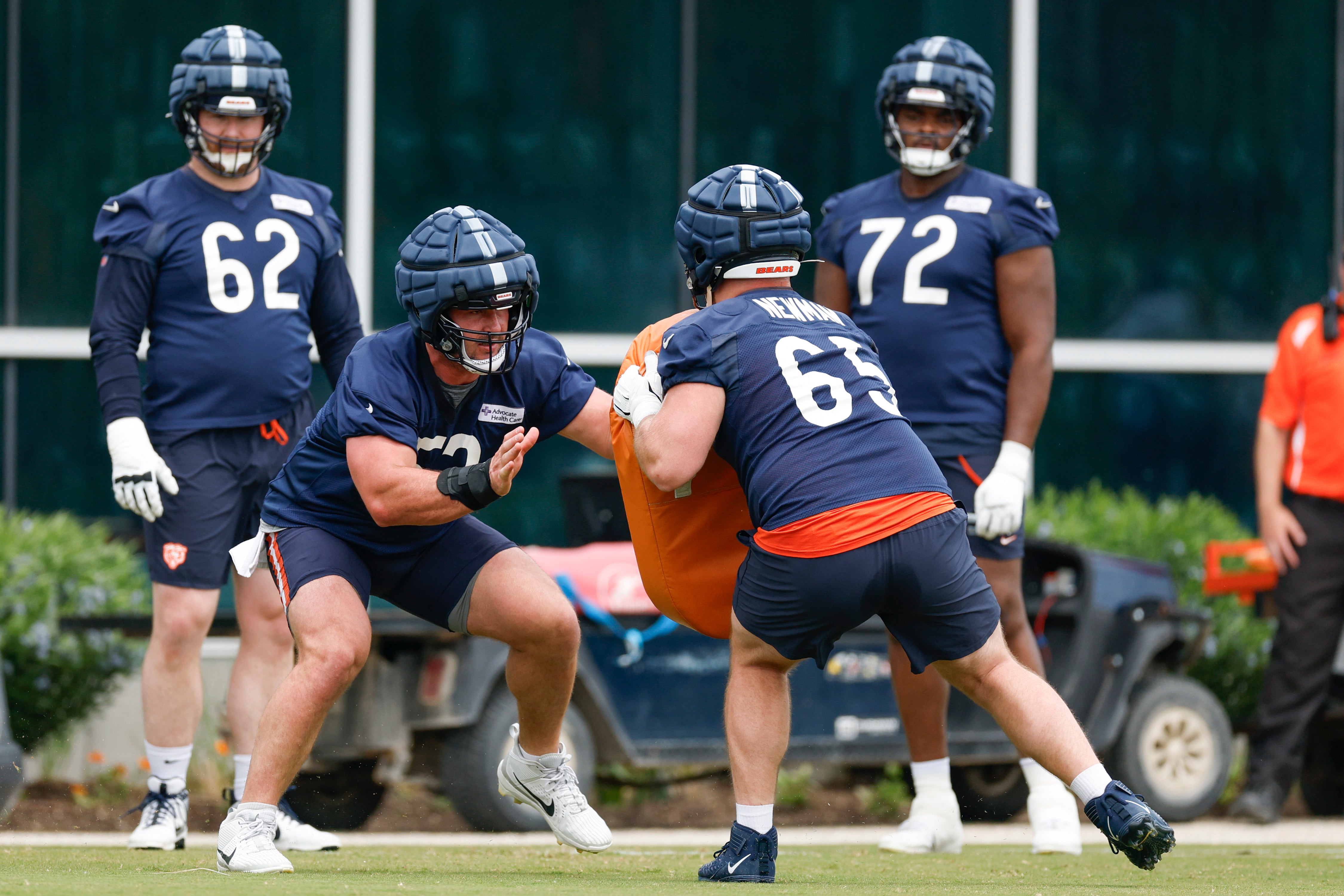 Jun 3, 2025; Lake Forest, IL, USA; Chicago Bears center Drew Dalman (52) blocks against offensive tackle Luke Newman (65) during minicamp at Halas Hall.
