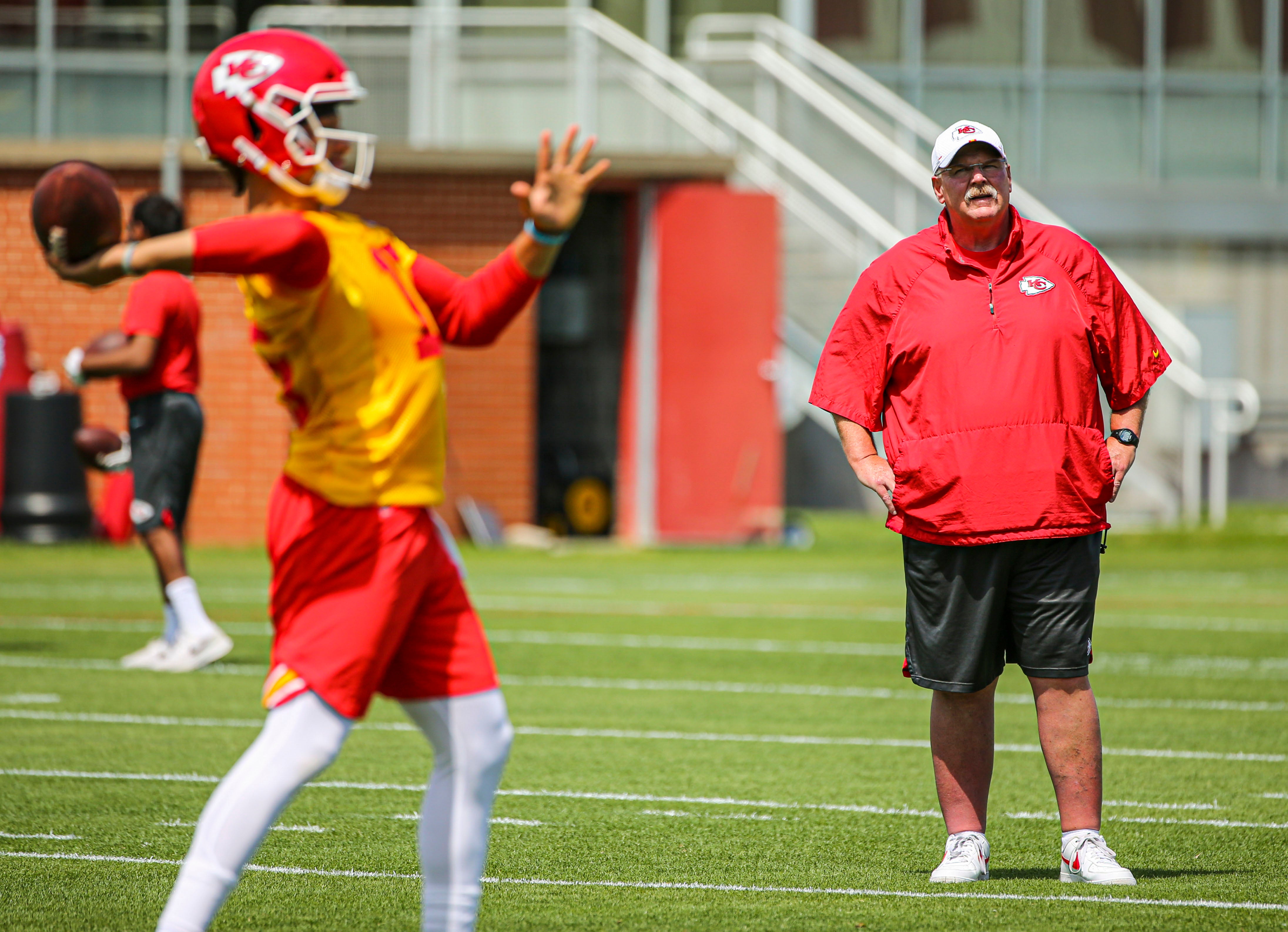 Jun 11, 2019; Kansas City, MO, USA; Kansas City Chiefs head coach Andy Reid and quarterback Patrick Mahomes (15) during minicamp at University of Kansas Health System Training Complex.