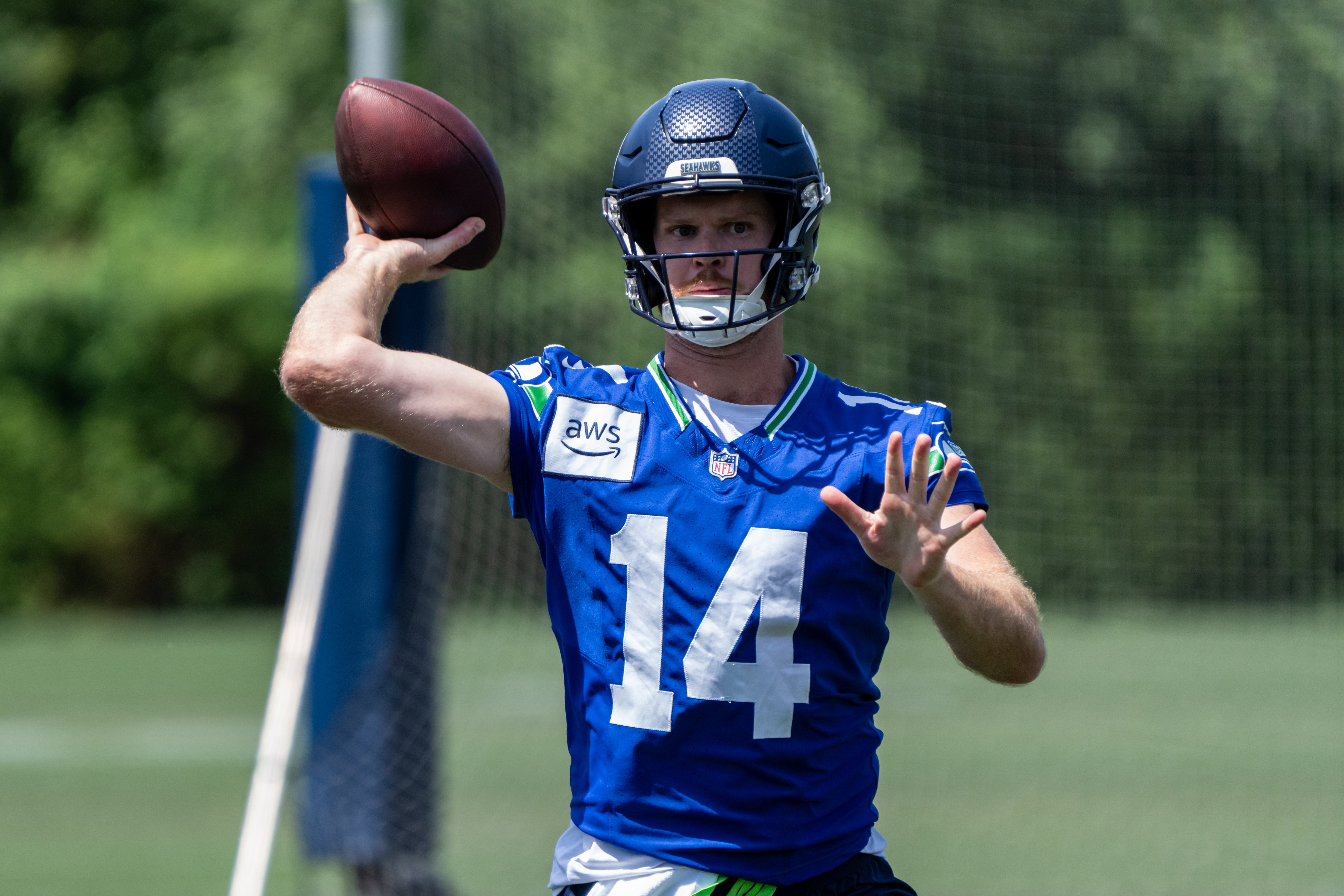 Jun 11, 2025; Renton, WA, USA; Seattle Seahawks quarterback Sam Darnold (14) passes the ball during mini-camp at Virginia Mason Athletic Center.