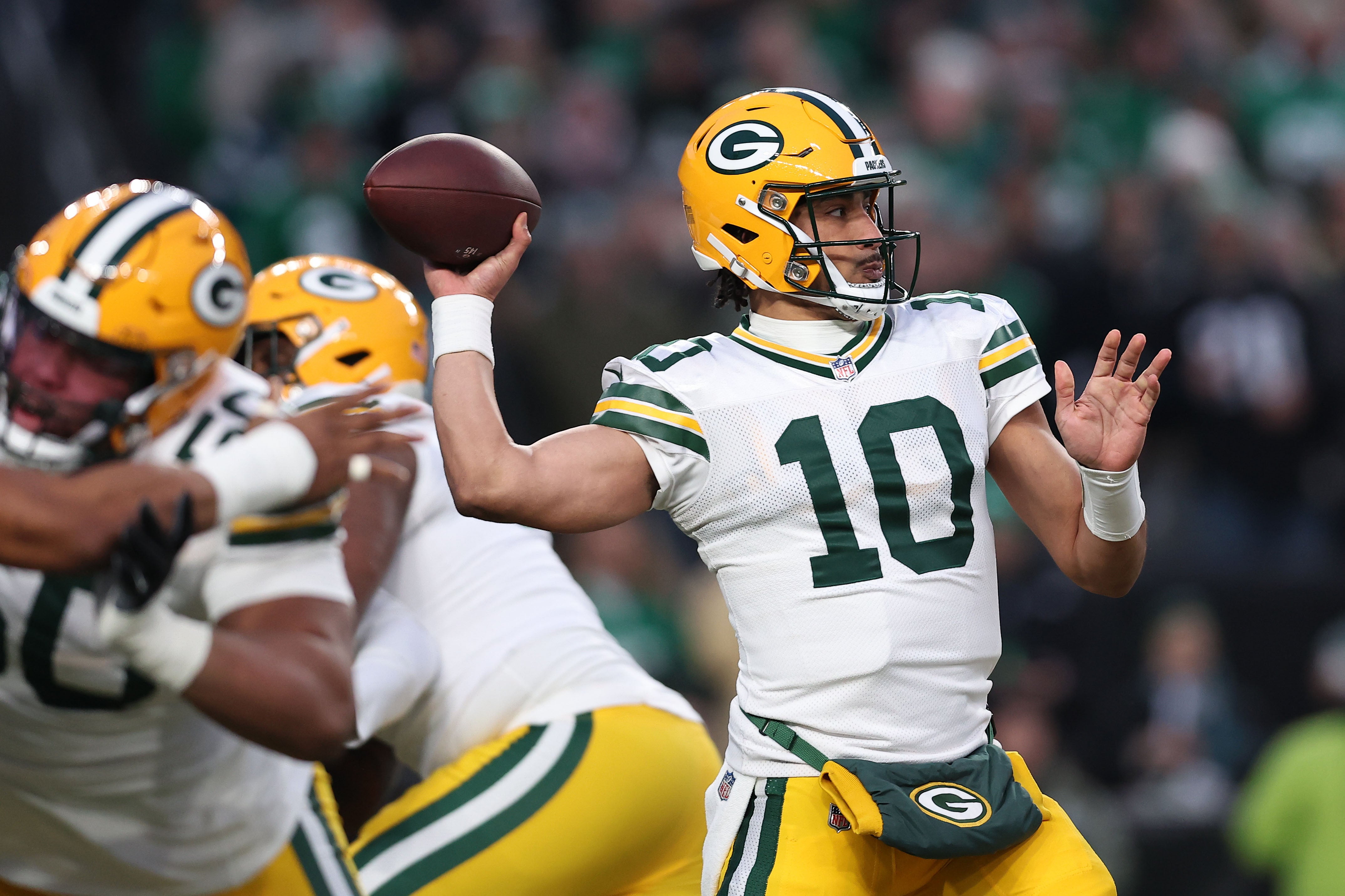 Jan 12, 2025; Philadelphia, Pennsylvania, USA; Green Bay Packers quarterback Jordan Love (10) drops back to pass against the Philadelphia Eagles during the first quarter in the NFC wild card game at Lincoln Financial Field