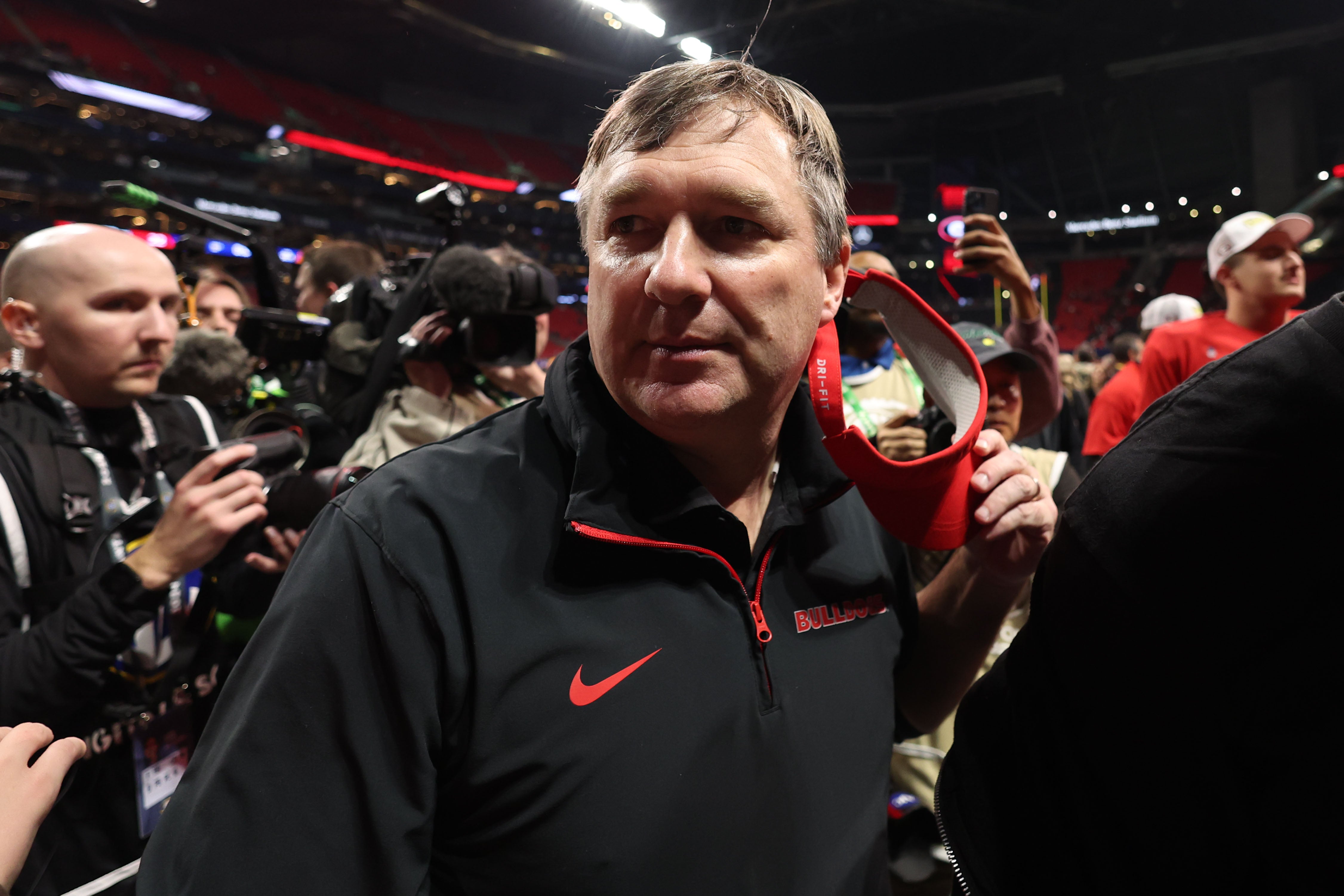 Georgia Bulldogs head coach Kirby Smart reacts after defeating the Texas Longhorns in overtime in the 2024 SEC Championship game at Mercedes-Benz Stadium.