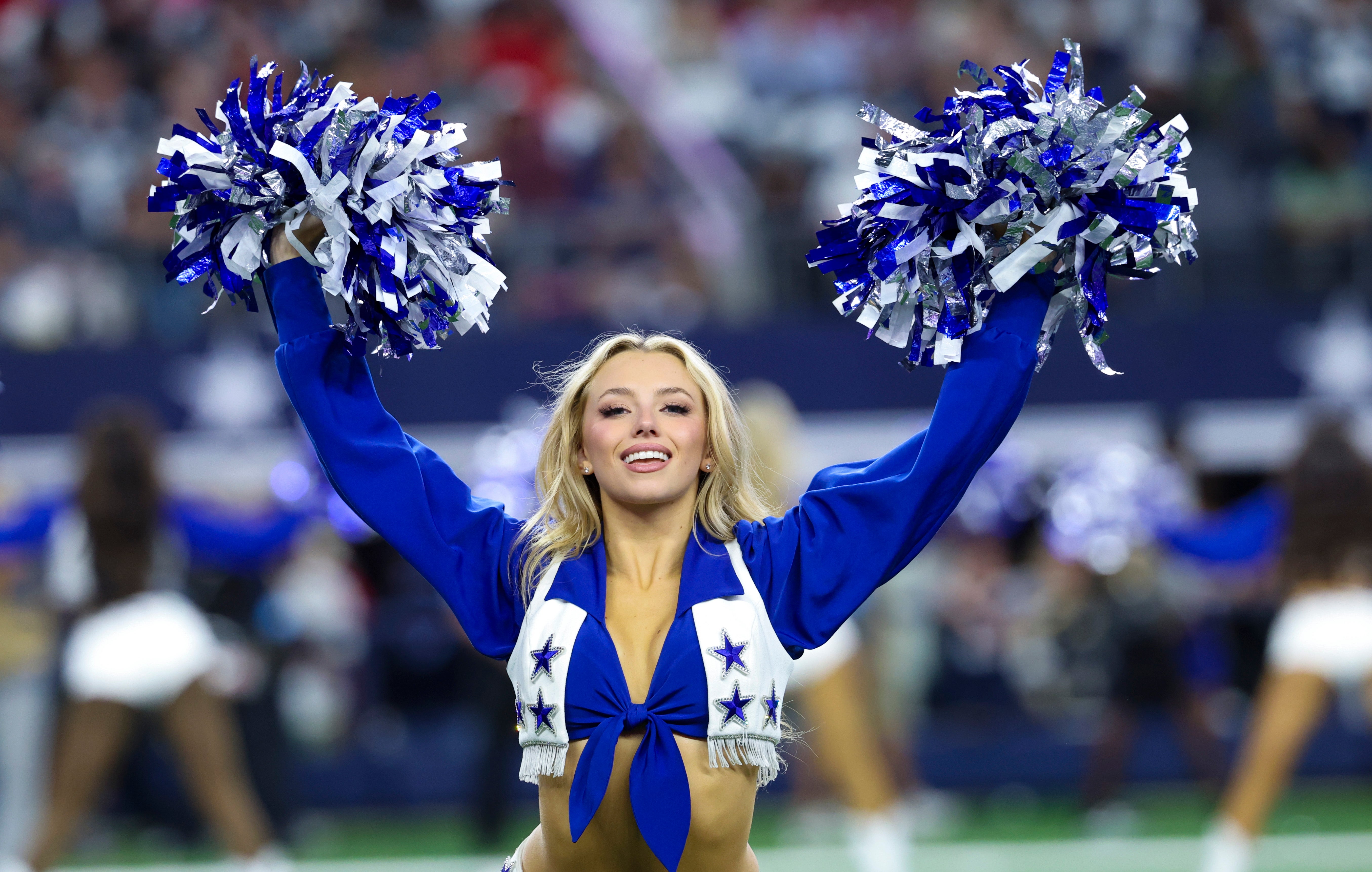 Dallas Cowboys cheerleader performs during the second half against the Houston Texans at AT&T Stadium.