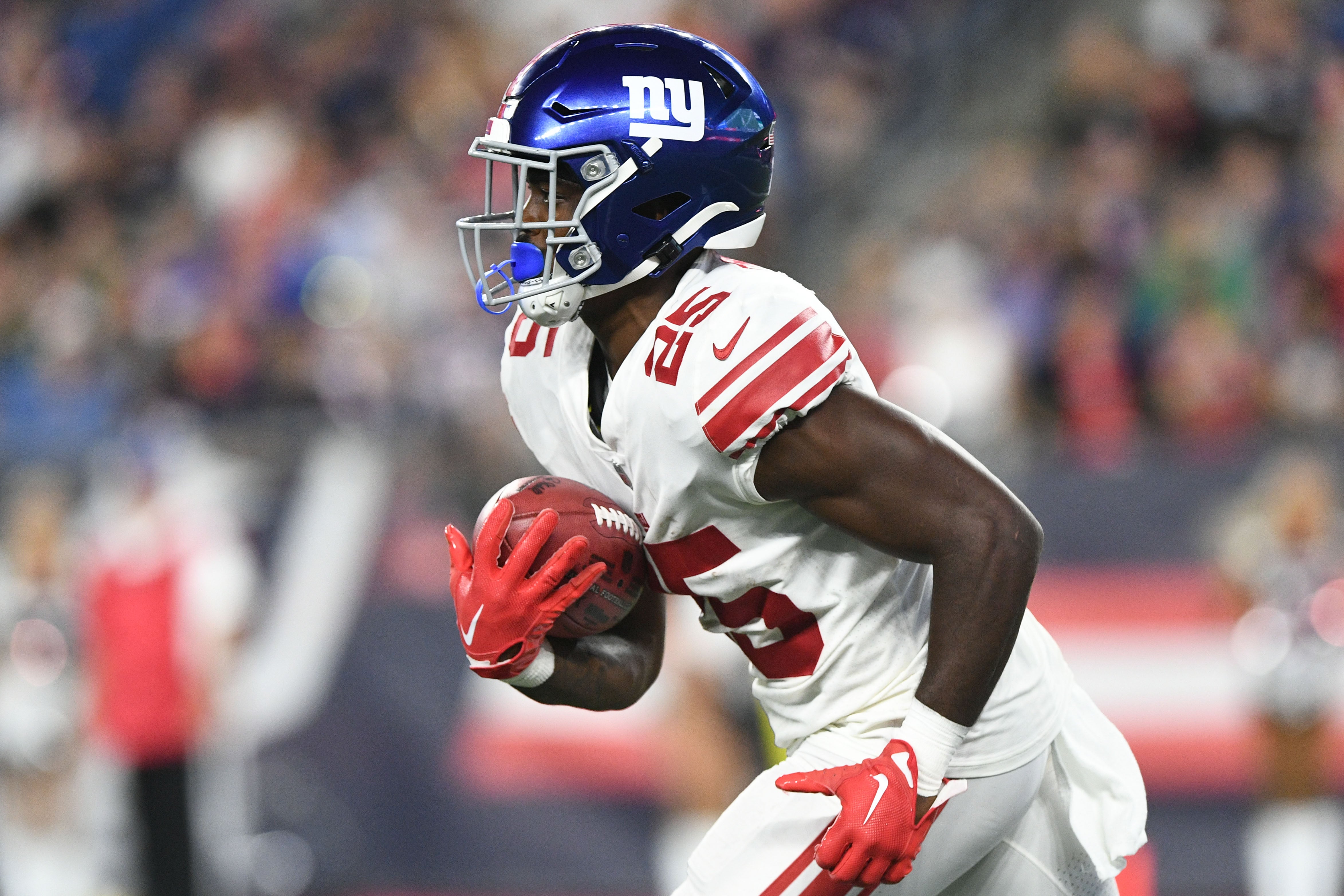 Aug 11, 2022; Foxborough, Massachusetts, USA; New York Giants running back Jashaun Corbin (25) returns the ball against the New England Patriots during the second half at Gillette Stadium.