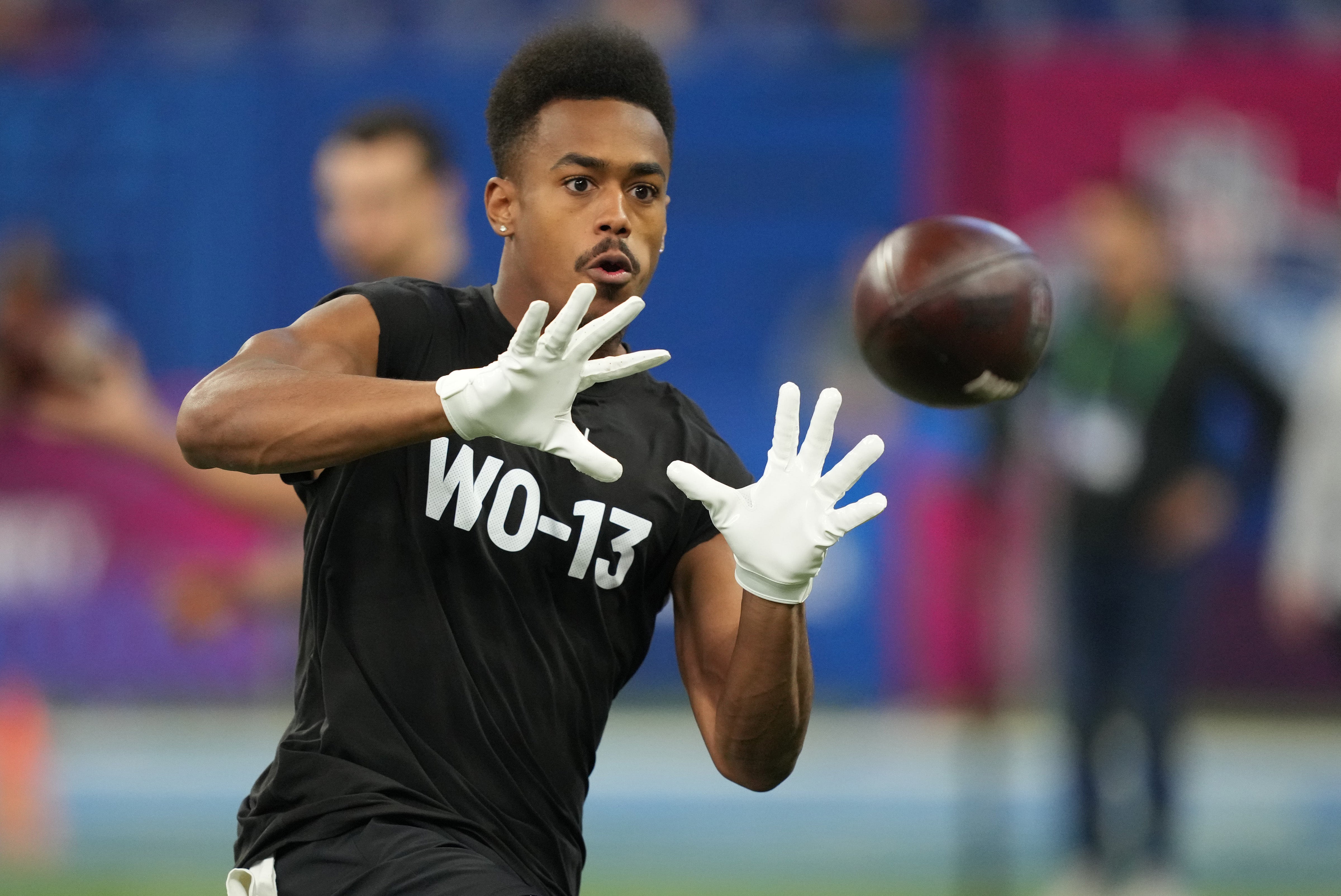 Michigan wide receiver Cornelius Johnson (WO13) during the 2024 NFL Combine at Lucas Oil Stadium.