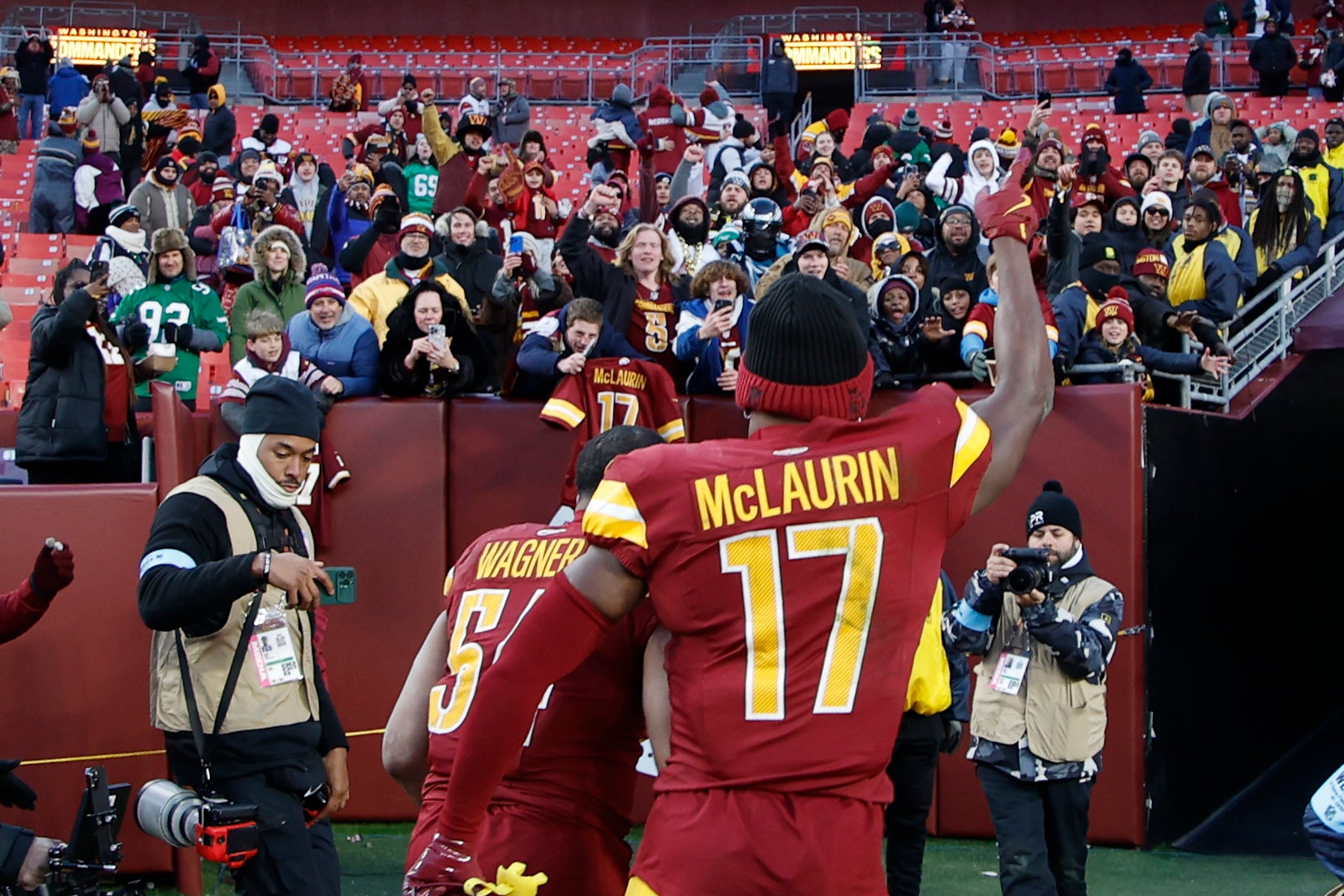 Dec 22, 2024; Landover, Maryland, USA; Washington Commanders wide receiver Terry McLaurin (17) celebrates while leaving the field with Commanders linebacker Bobby Wagner (54) after their game against the Philadelphia Eagles at Northwest Stadium.