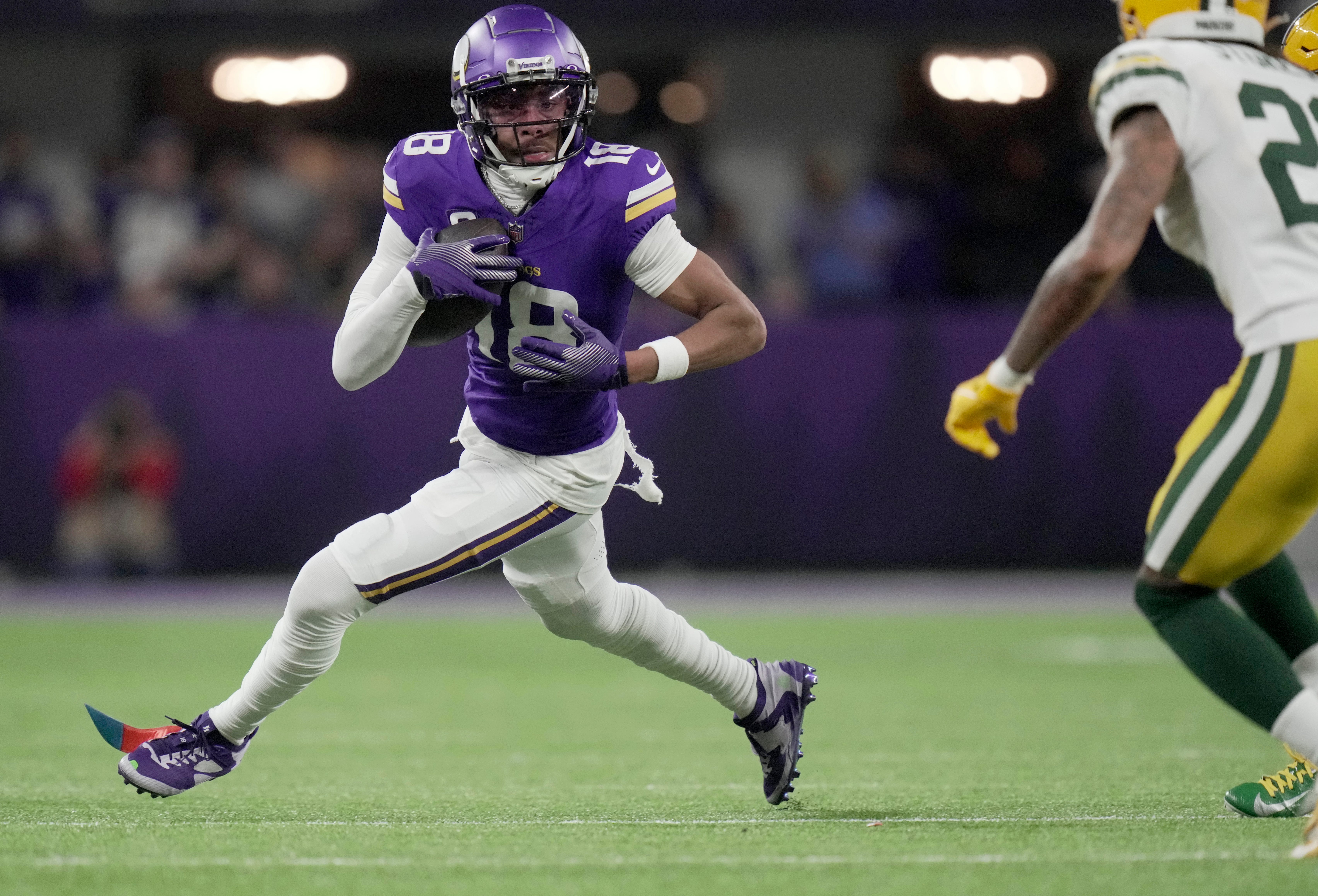 Minnesota Vikings wide receiver Justin Jefferson (18) looks for running room after a reception during the third quarter of their game Sunday, December 29, 2024 at U.S. Bank Stadium in Minneapolis, Minnesota. The Minnesota Vikings beat the Green Bay Packers 27-25.