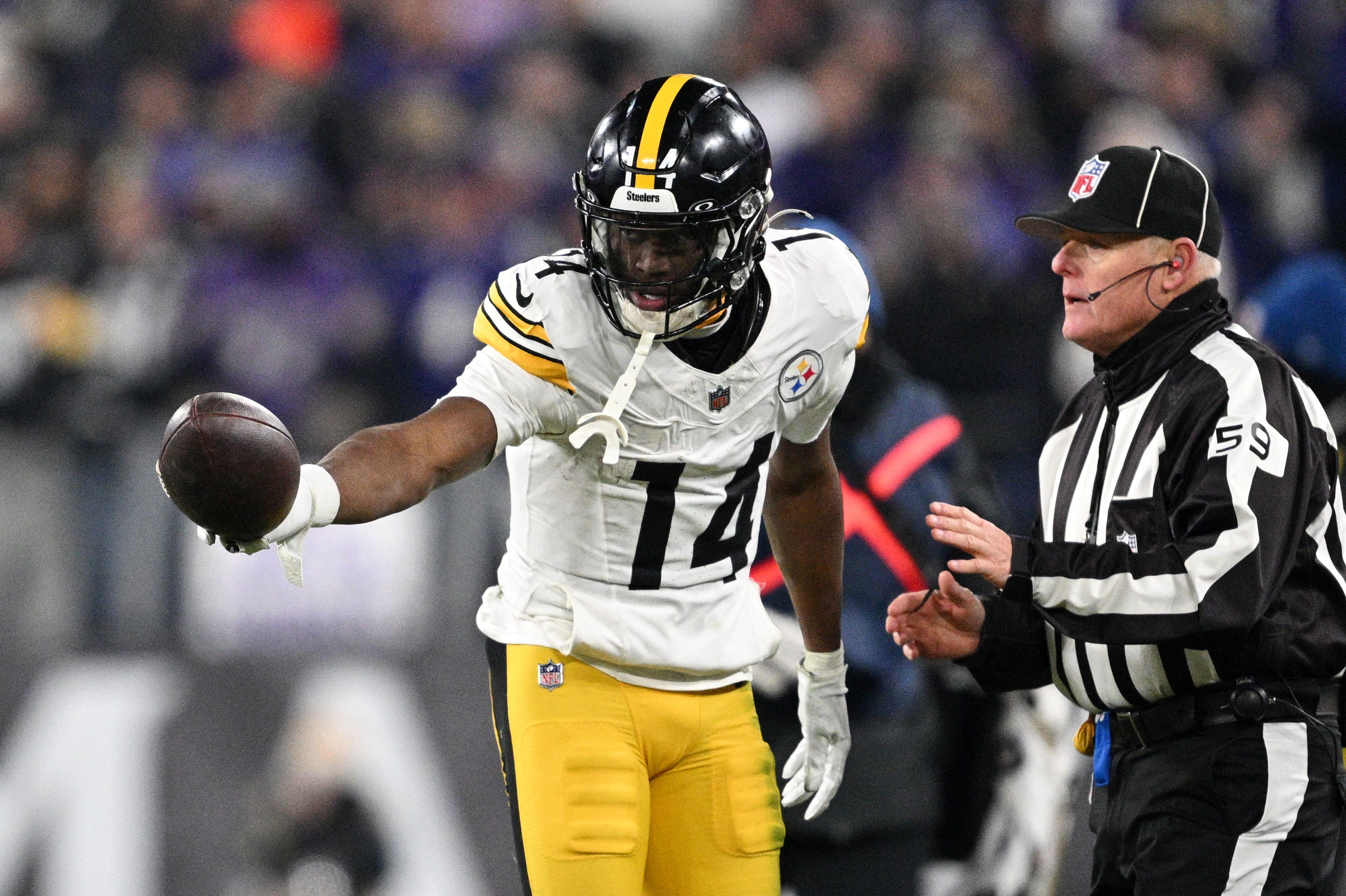 Jan 11, 2025; Baltimore, Maryland, USA; Pittsburgh Steelers wide receiver George Pickens (14) reacts after a catch against the Baltimore Ravens in the fourth quarter in an AFC wild card game at M&T Bank Stadium.