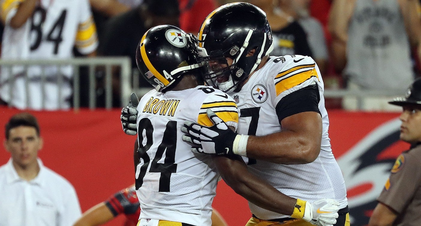 Sep 24, 2018; Tampa, FL, USA; Pittsburgh Steelers wide receiver Antonio Brown (84) celebrates with defensive tackle Cameron Heyward (97) as he scores a touchdown against the Tampa Bay Buccaneers during the first half at Raymond James Stadium.