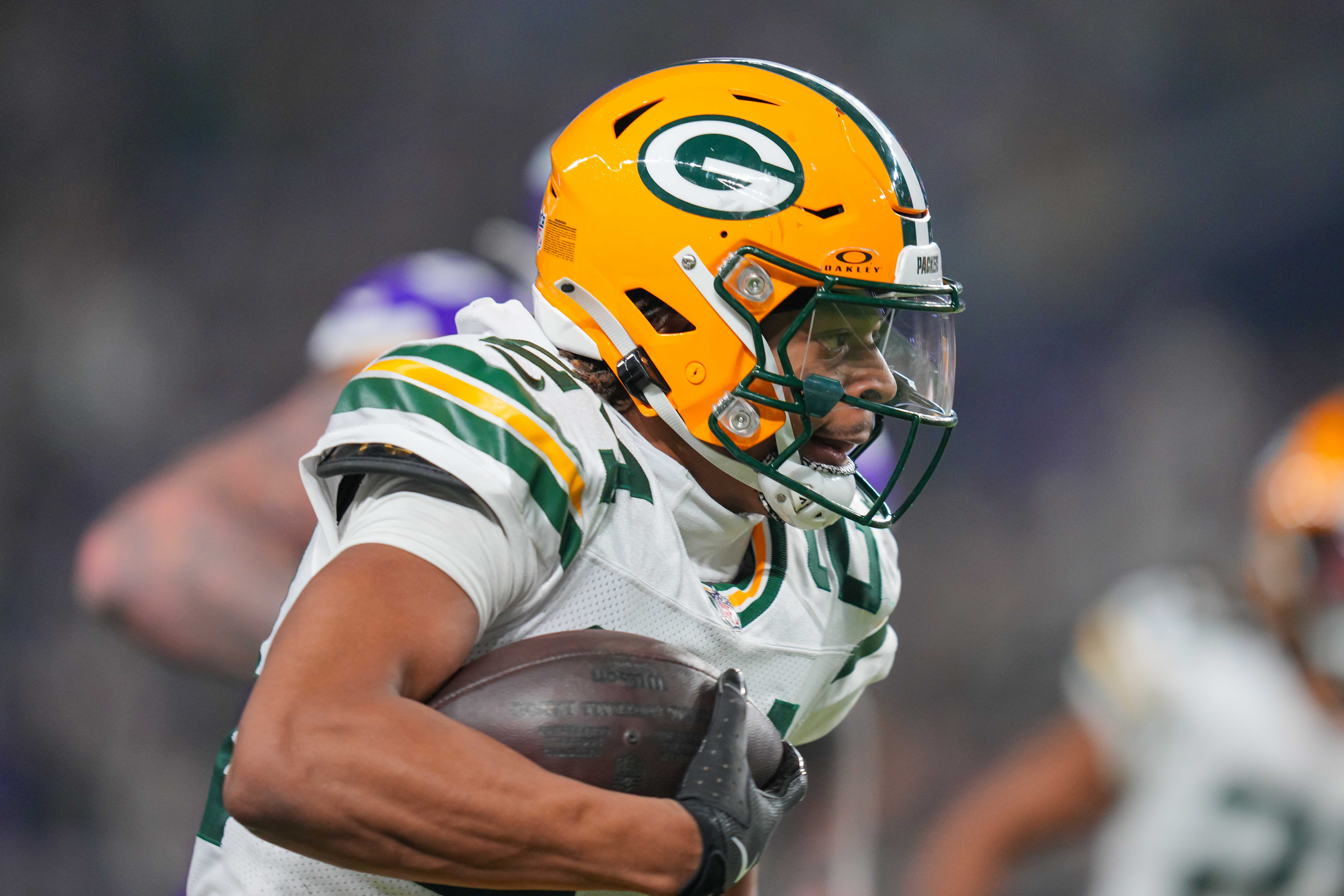 Green Bay Packers cornerback Carrington Valentine (24) runs with the ball after his interception against Minnesota Vikings in the third quarter at U.S. Bank Stadium.