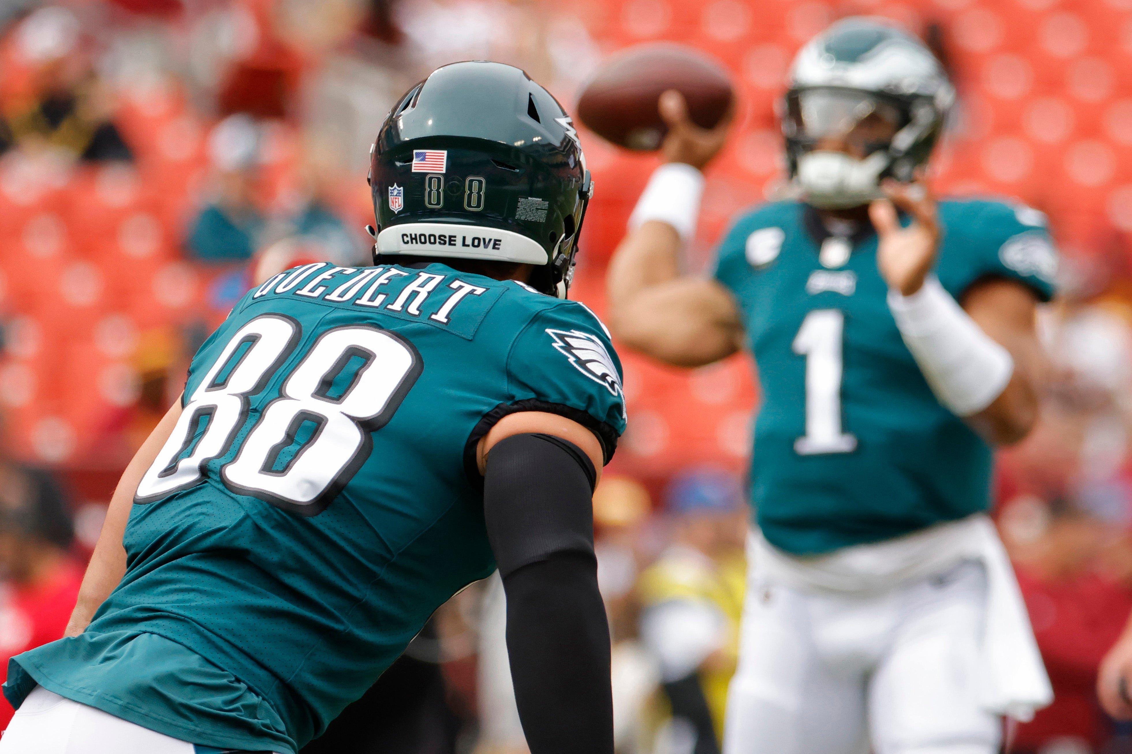 Philadelphia Eagles quarterback Jalen Hurts (1) passes the ball to Eagles tight end Dallas Goedert (88) during warmup prior to the Eagles' game against the Washington Commanders at FedExField.