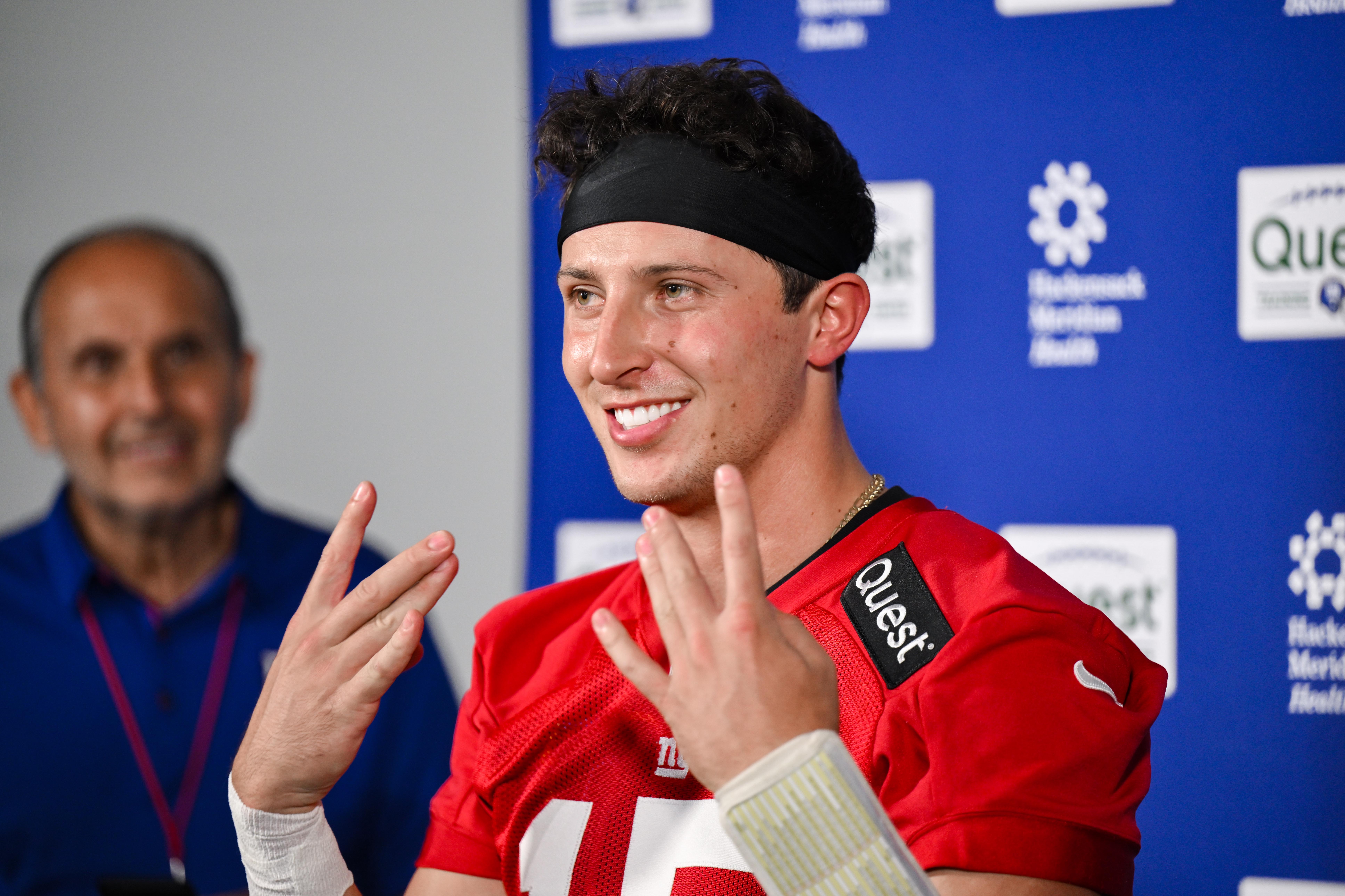 Jun 18, 2025; East Rutherford, NJ, USA; New York Giants quarterback Tommy DeVito (15) speaks at a press conference during minicamp at Quest Diagnostics Training Center.