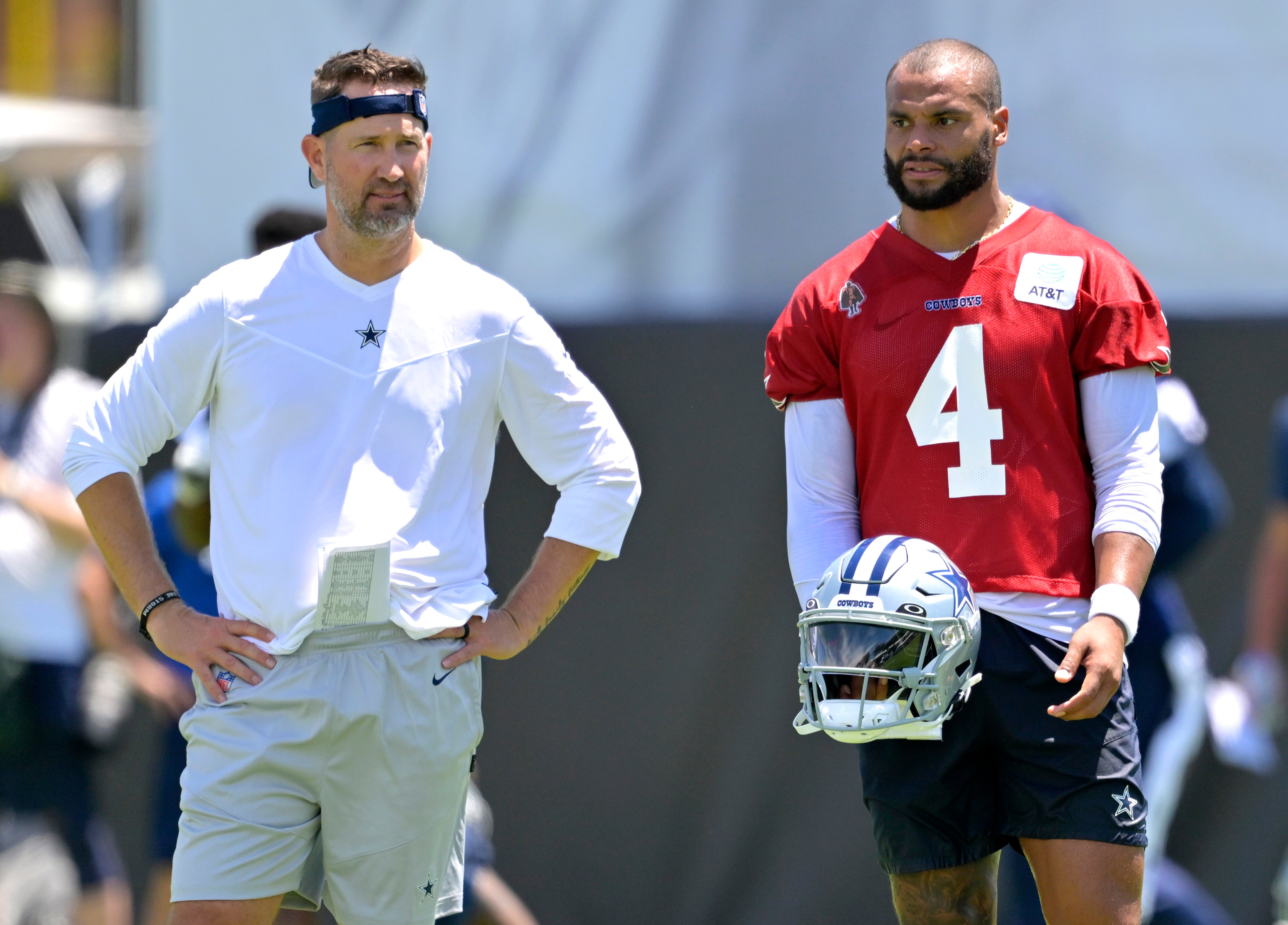 Dallas Cowboys quarterback Dak Prescott (4) talks with offensive coordinator Brian Schottenheimer during training camp at River Ridge Playing Fields in Oxnard, CA.