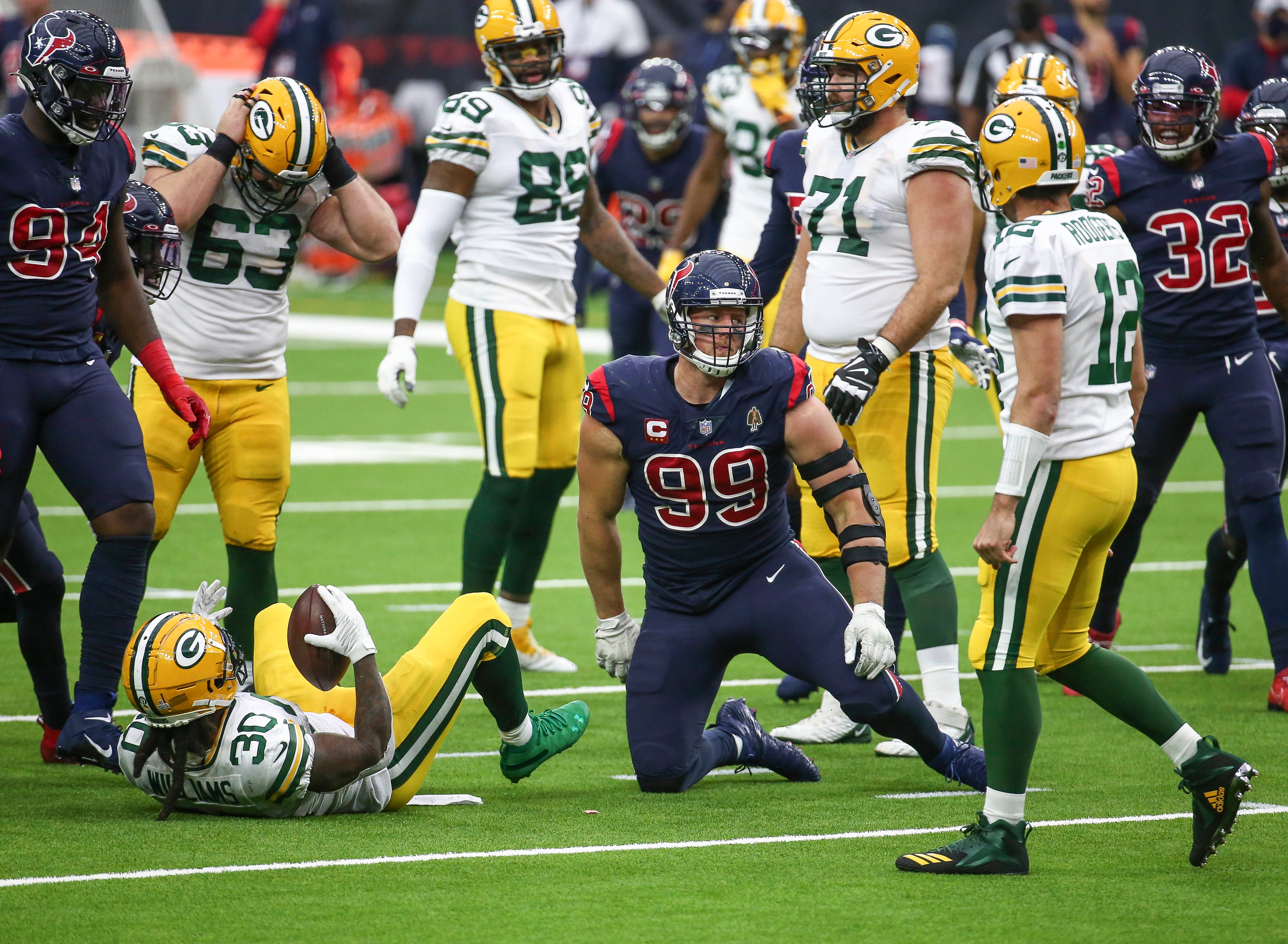 Houston Texans defensive end J.J. Watt (99) reacts after making a tackle of Green Bay Packers running back Jamaal Williams (30) during the fourth quarter at NRG Stadium.