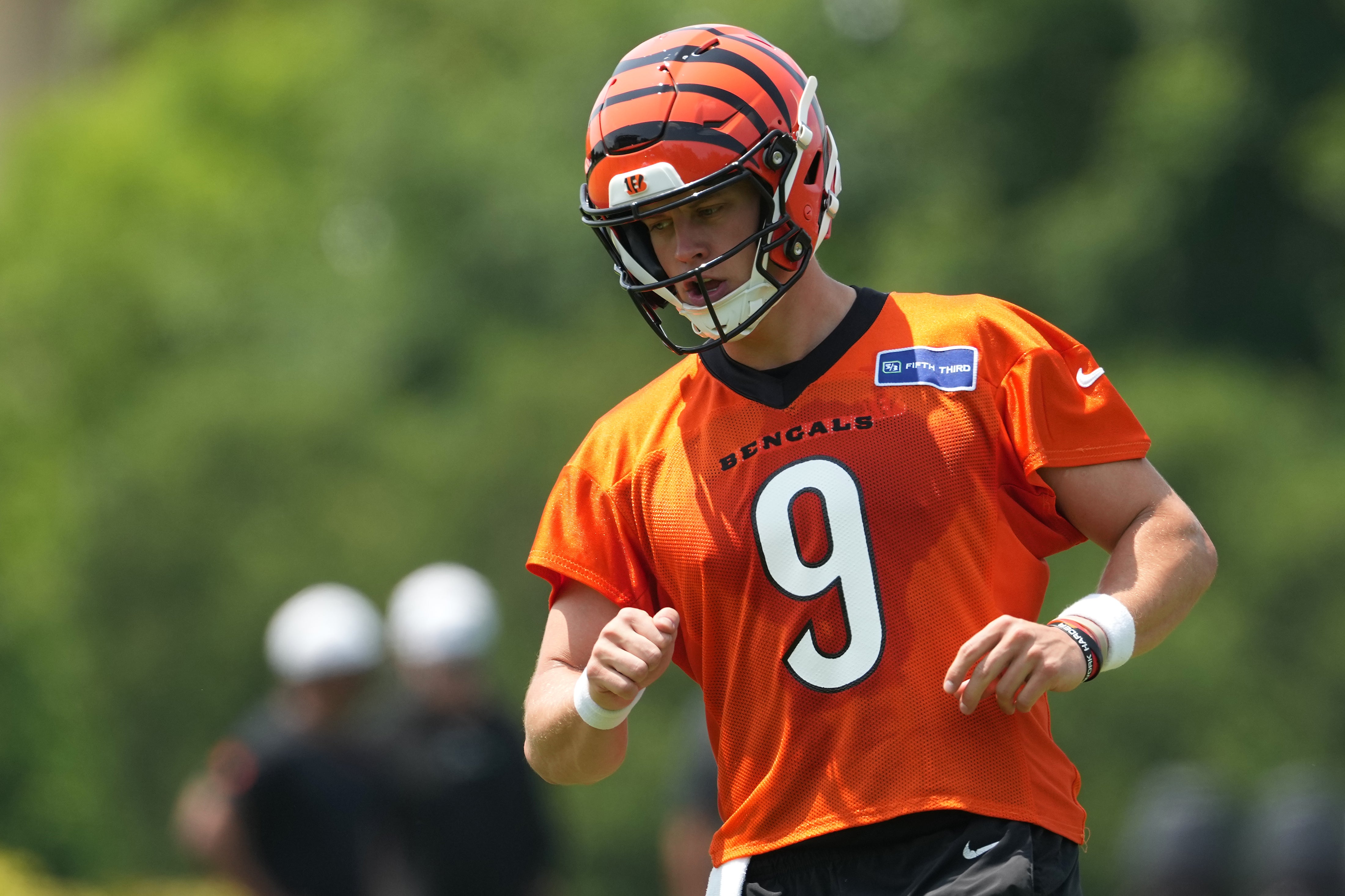 Jun 10, 2025; Cincinnati, OH, USA; Cincinnati Bengals quarterback Joe Burrow (9) jogs practice at Paycor Stadium.
