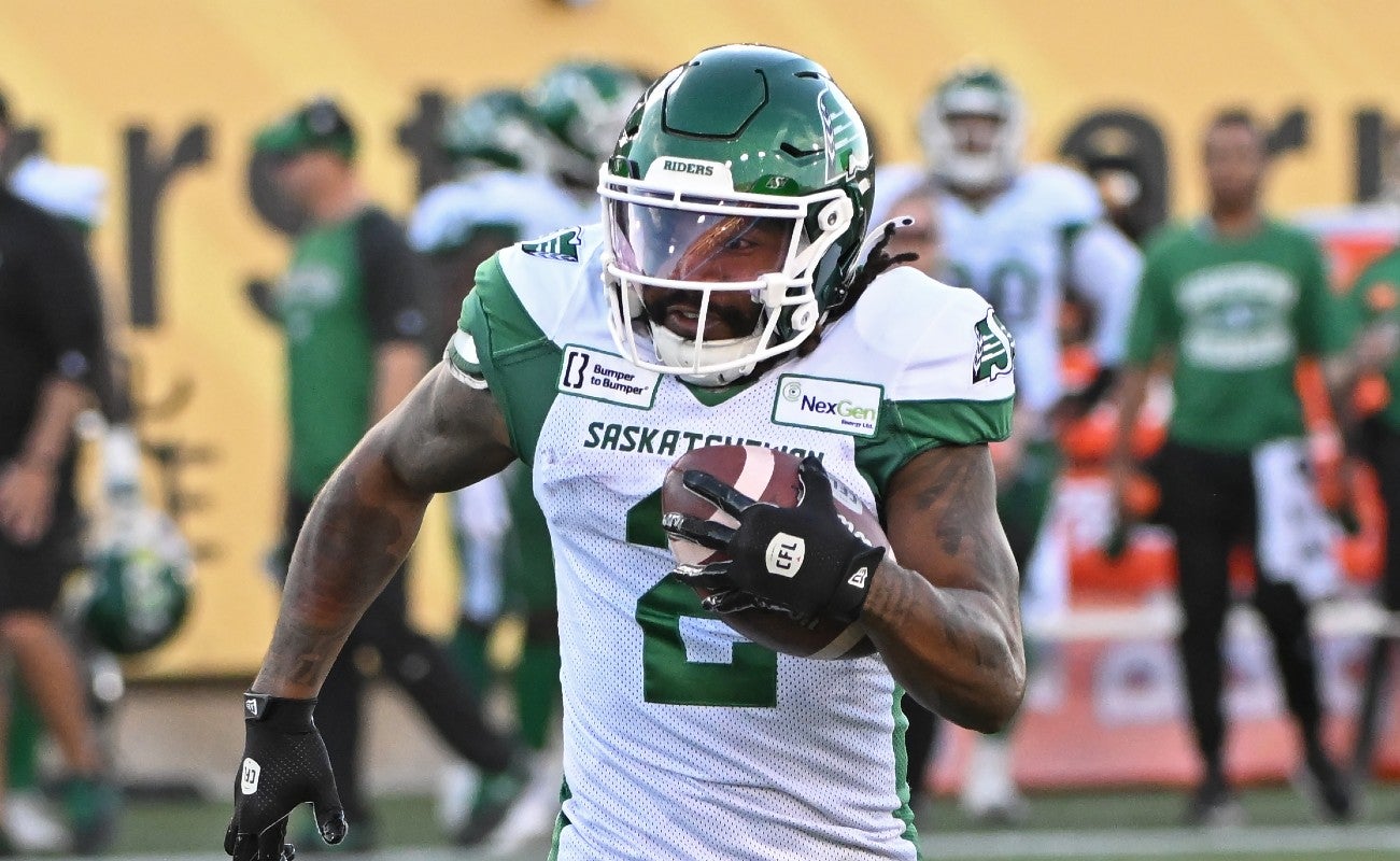 Jun 16, 2024; Hamilton, Ontario, CAN; Saskatchewan Rough Riders wide receiver Mario Alford (2) carries the ball in the first quarter against the Hamilton Tiger Cats at Tim Hortons Field.