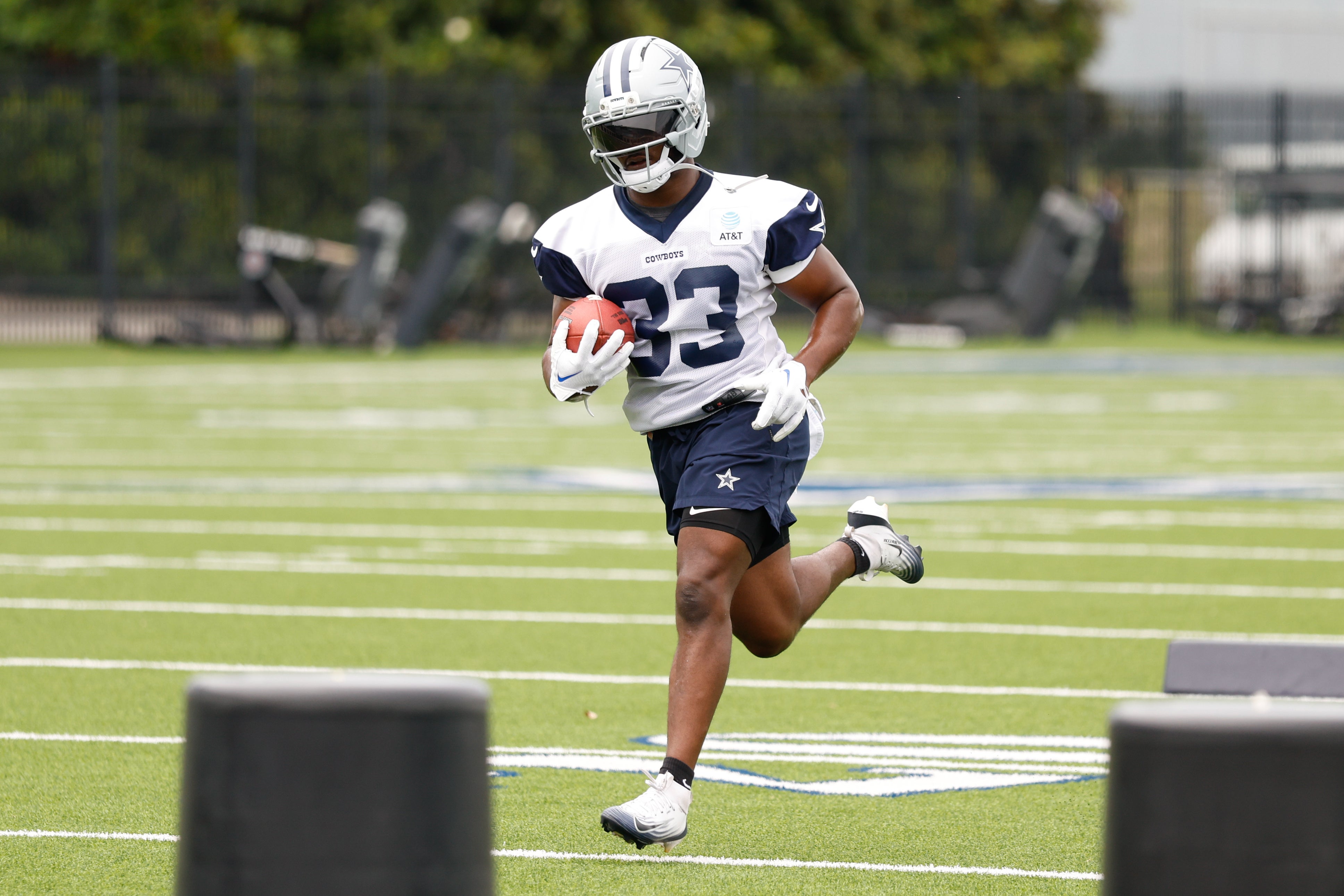 Dallas Cowboys running back Javonte Williams (33) goes through a drill during practice at the Ford Center at the Star Training Facility in Frisco, Texas.