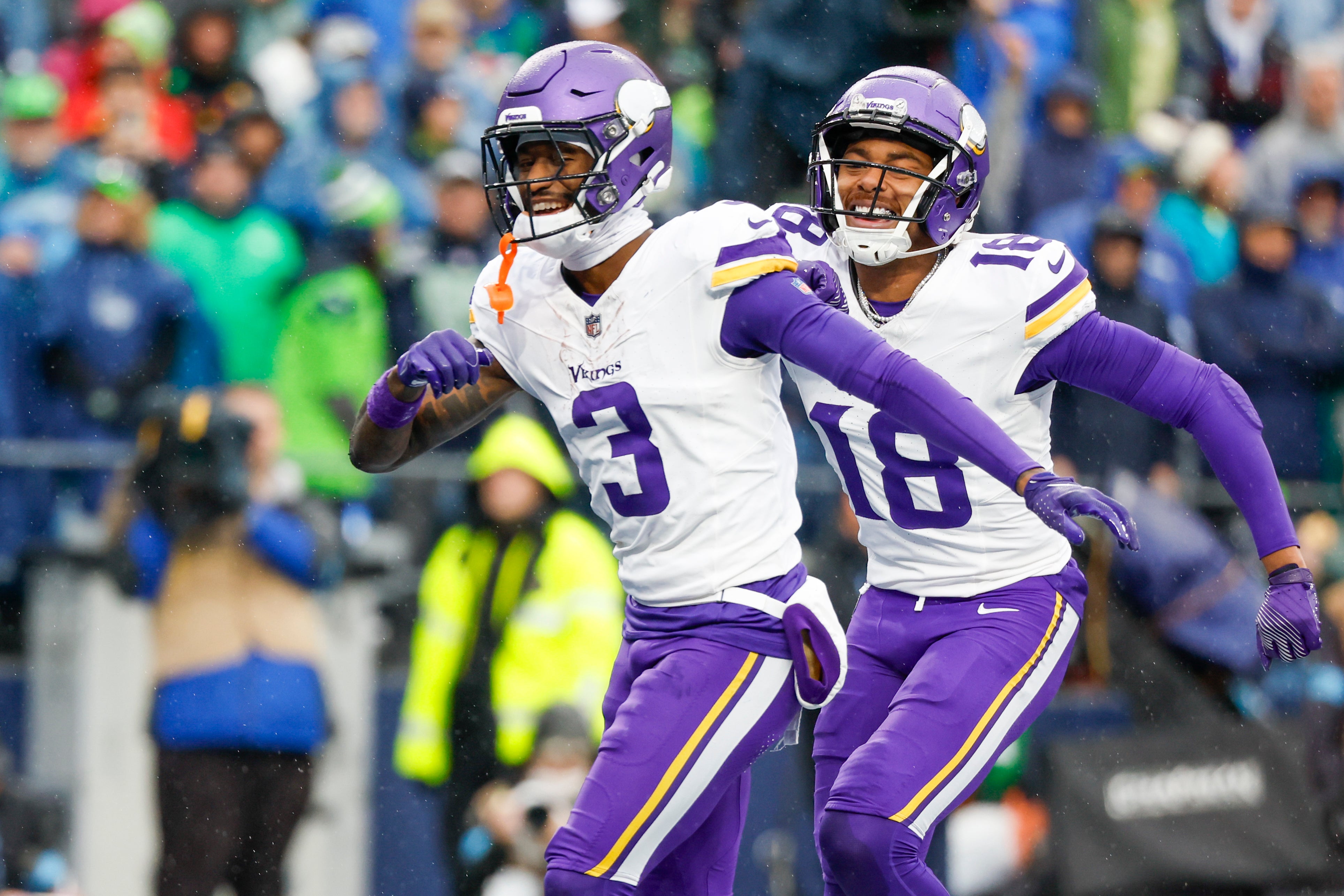 Dec 22, 2024; Seattle, Washington, USA; Minnesota Vikings wide receiver Jordan Addison (3) celebrates with wide receiver Justin Jefferson (18) after catching a touchdown pass against the Seattle Seahawks during the first quarter at Lumen Field.