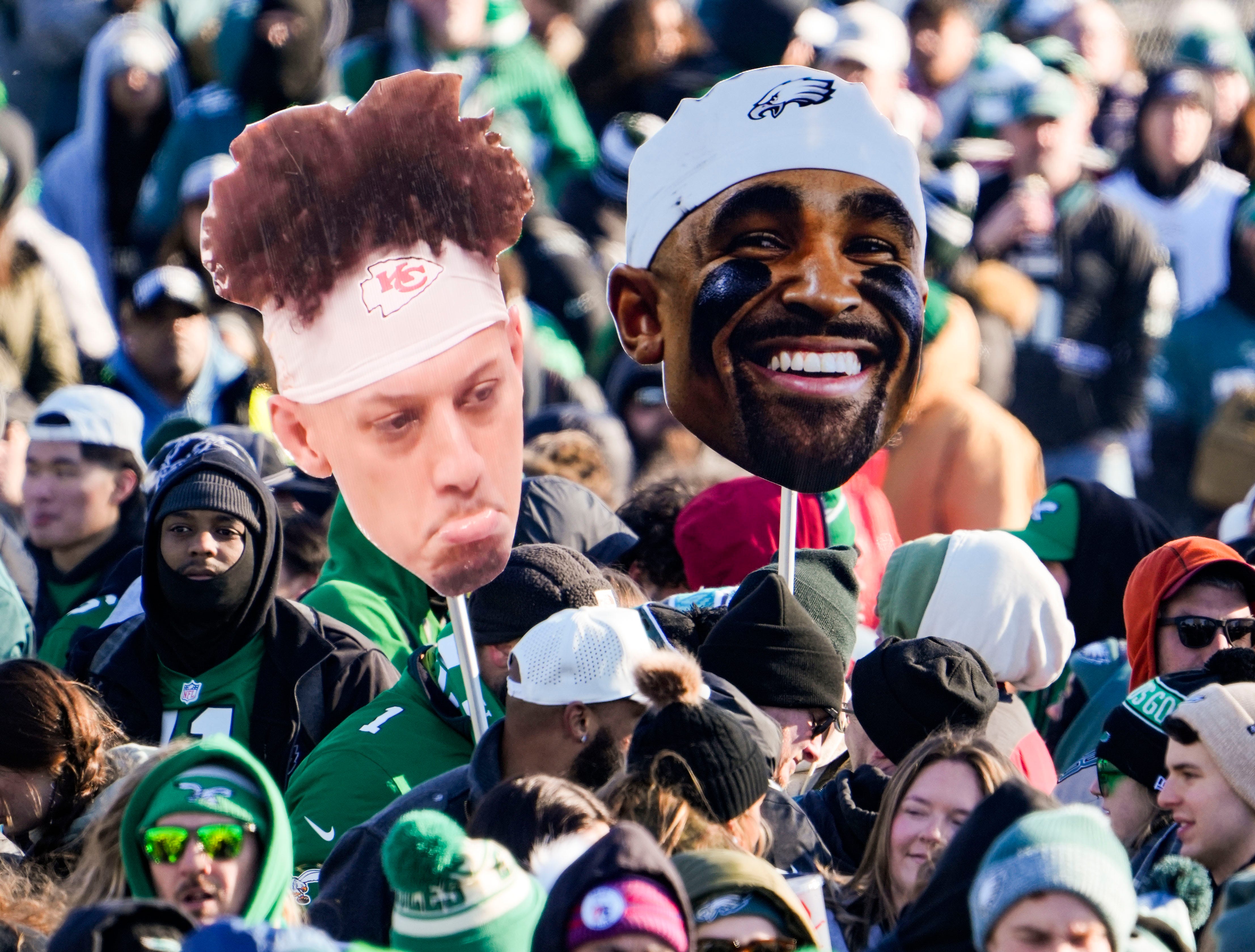 A sad Patrick Mahomes and happy Jalen Hurts appear in front of the Philadelphia Art Museum hours before a parade is expected to arrive celebrating the Philadelphia Eagles' Super Bowl win, Friday.