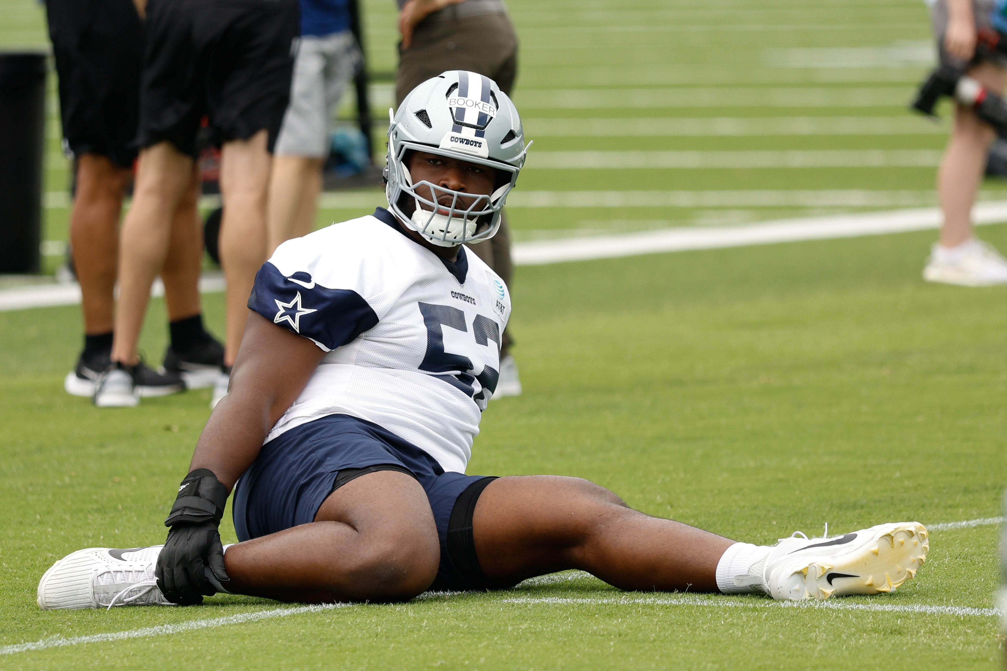 Dallas Cowboys guard Tyler Booker (52) goes through a drill during practice at the Ford Center at the Star Training Facility in Frisco, Texas.