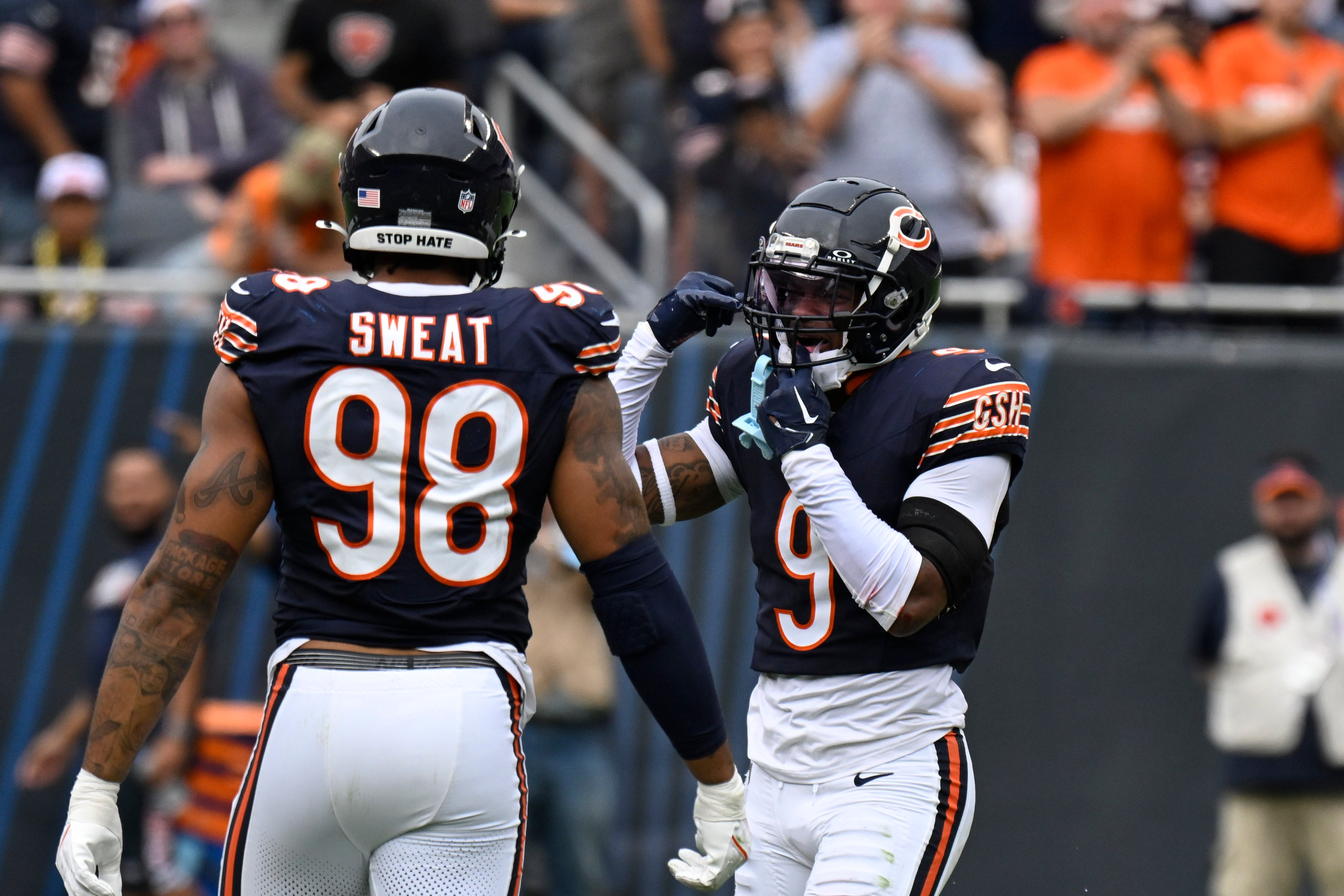 Sep 29, 2024; Chicago, Illinois, USA; Chicago Bears safety Jaquan Brisker (9) celebrates with defensive end Montez Sweat (98) after Brisker sacked Los Angeles Rams quarterback Matthew Stafford (9) during the second half at Soldier Field.