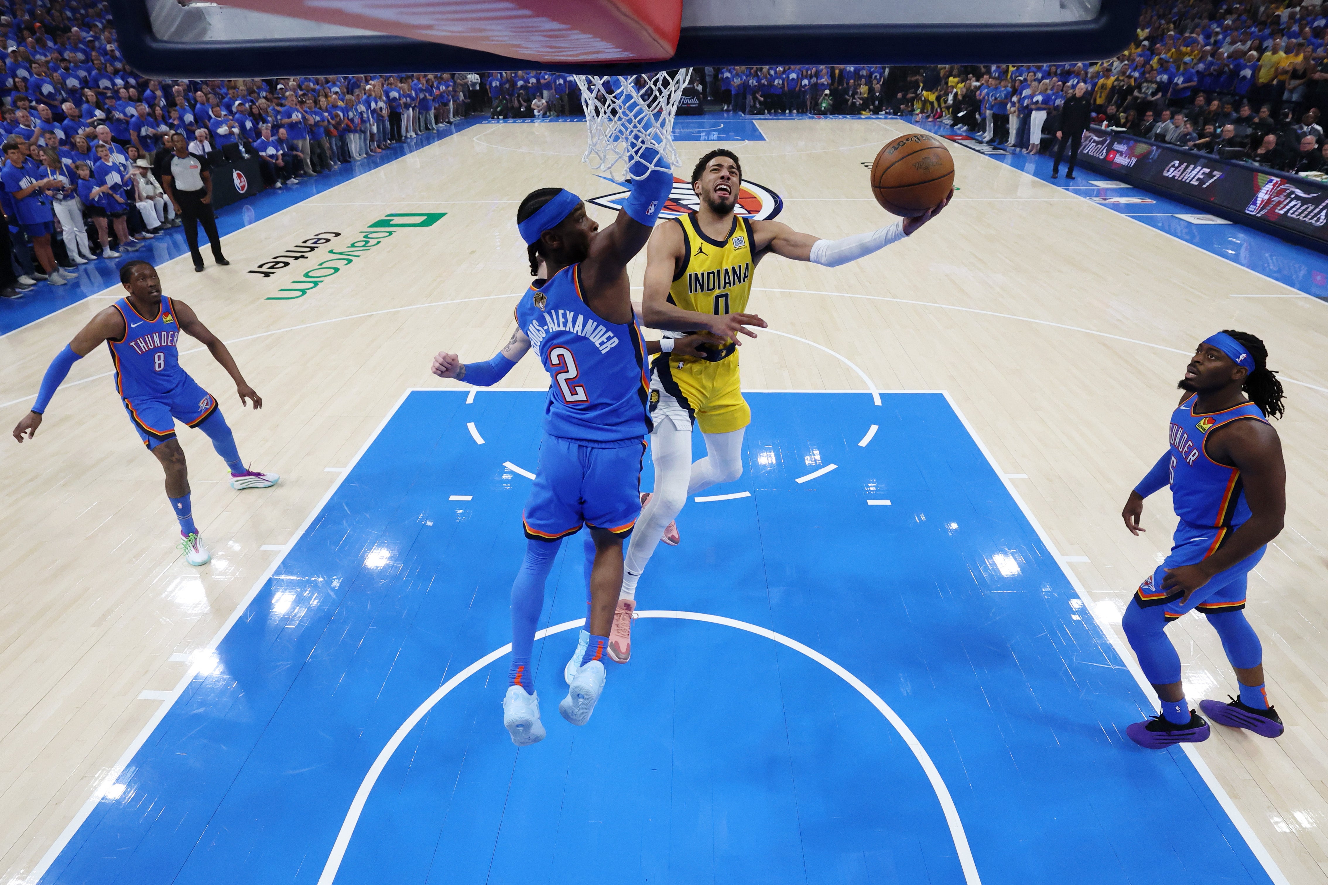 Jun 22, 2025; Oklahoma City, Oklahoma, USA; Indiana Pacers guard Tyrese Haliburton (0) drives to the basket against Oklahoma City Thunder guard Shai Gilgeous-Alexander (2) during game seven of the 2025 NBA Finals at Paycom Center. Mandatory Credit: