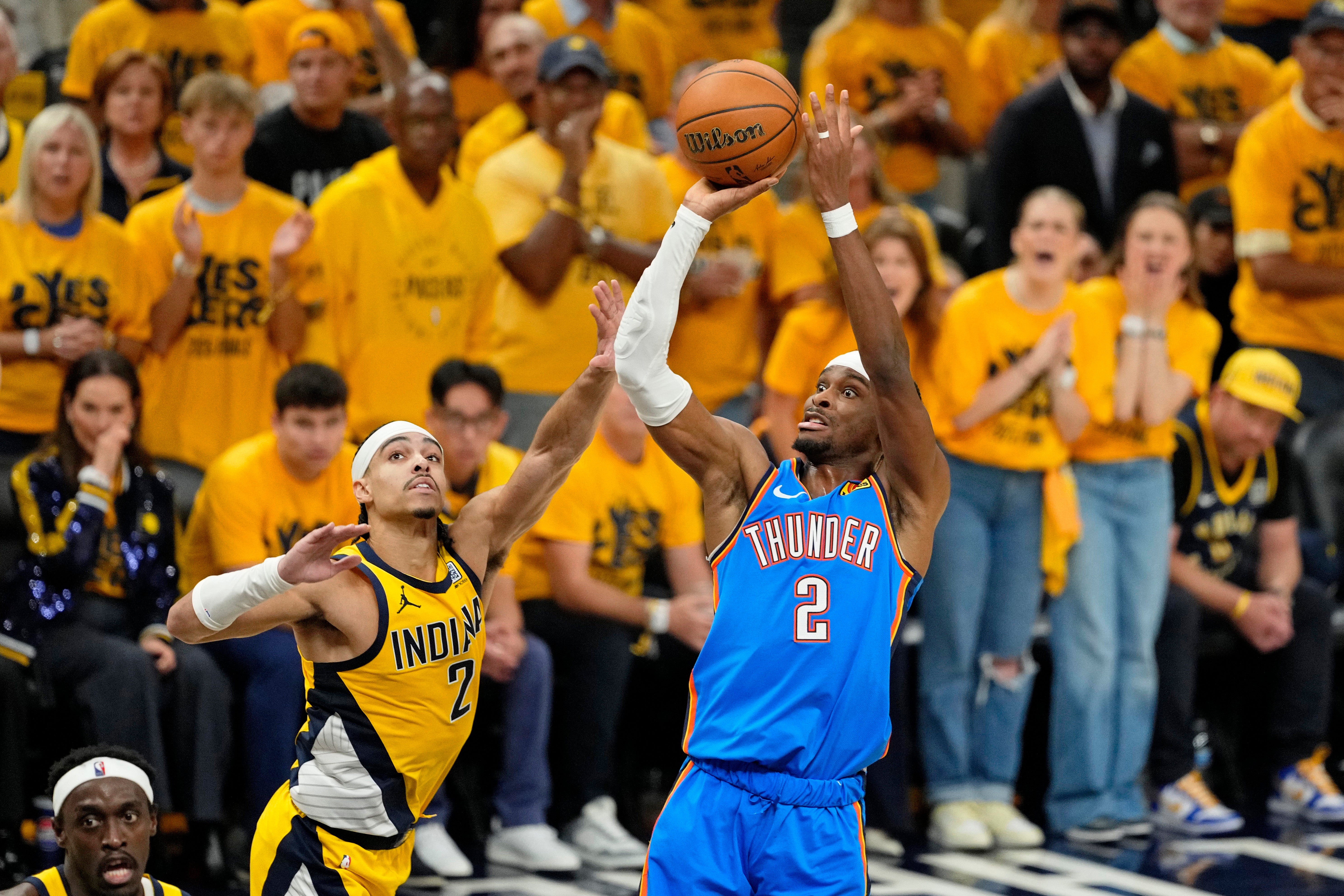 Oklahoma City Thunder guard Shai Gilgeous-Alexander (2) shoots the ball against Indiana Pacers guard Andrew Nembhard (2) during the first half of game six of the 2025 NBA Finals between the Oklahoma City Thunder and the Indiana Pacers at Gainbridge Fieldhouse.