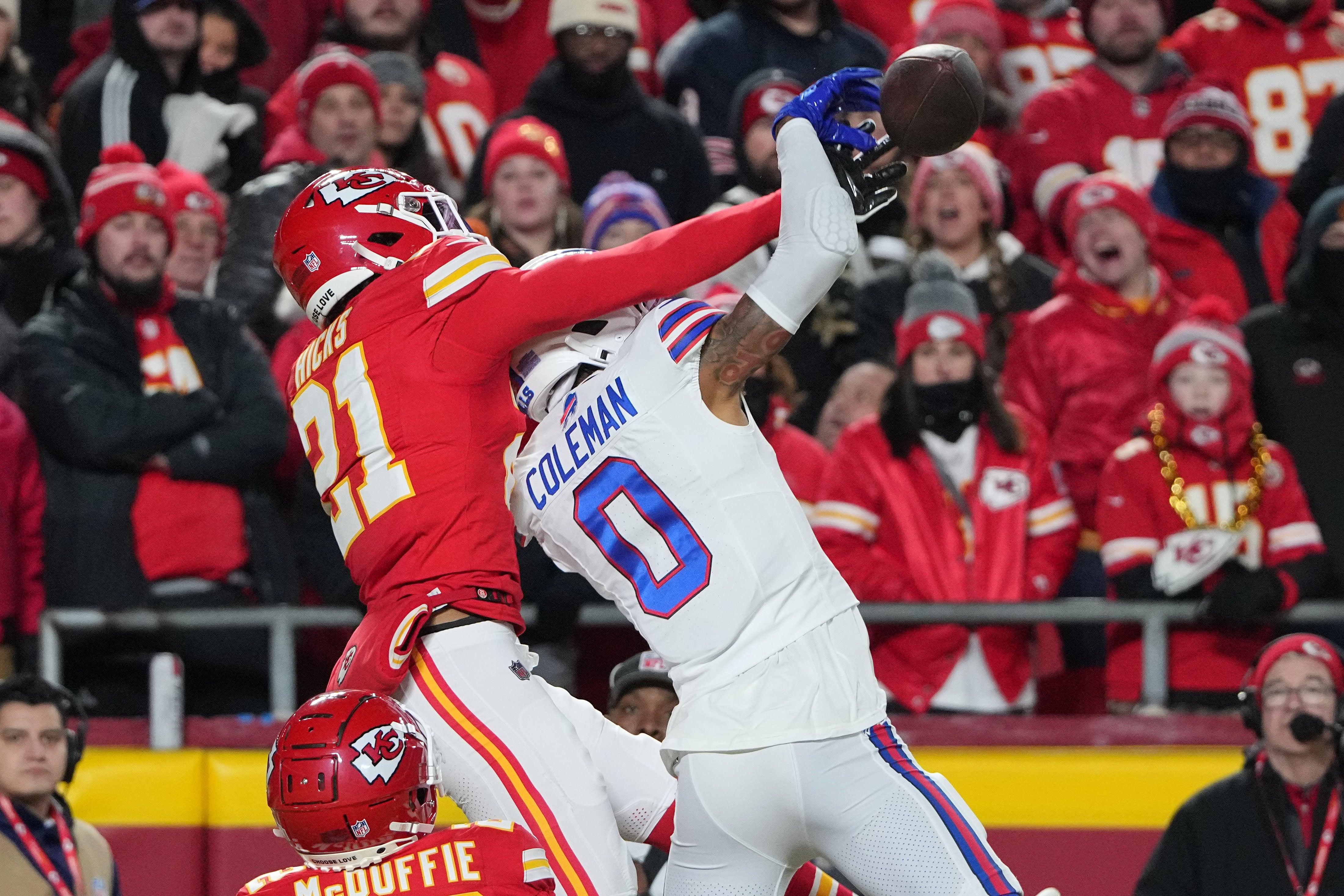 Jan 26, 2025; Kansas City, MO, USA; Buffalo Bills wide receiver Keon Coleman (0) attempts to make a catch over Kansas City Chiefs safety Jaden Hicks (21) in the AFC Championship game at GEHA Field at Arrowhead Stadium.