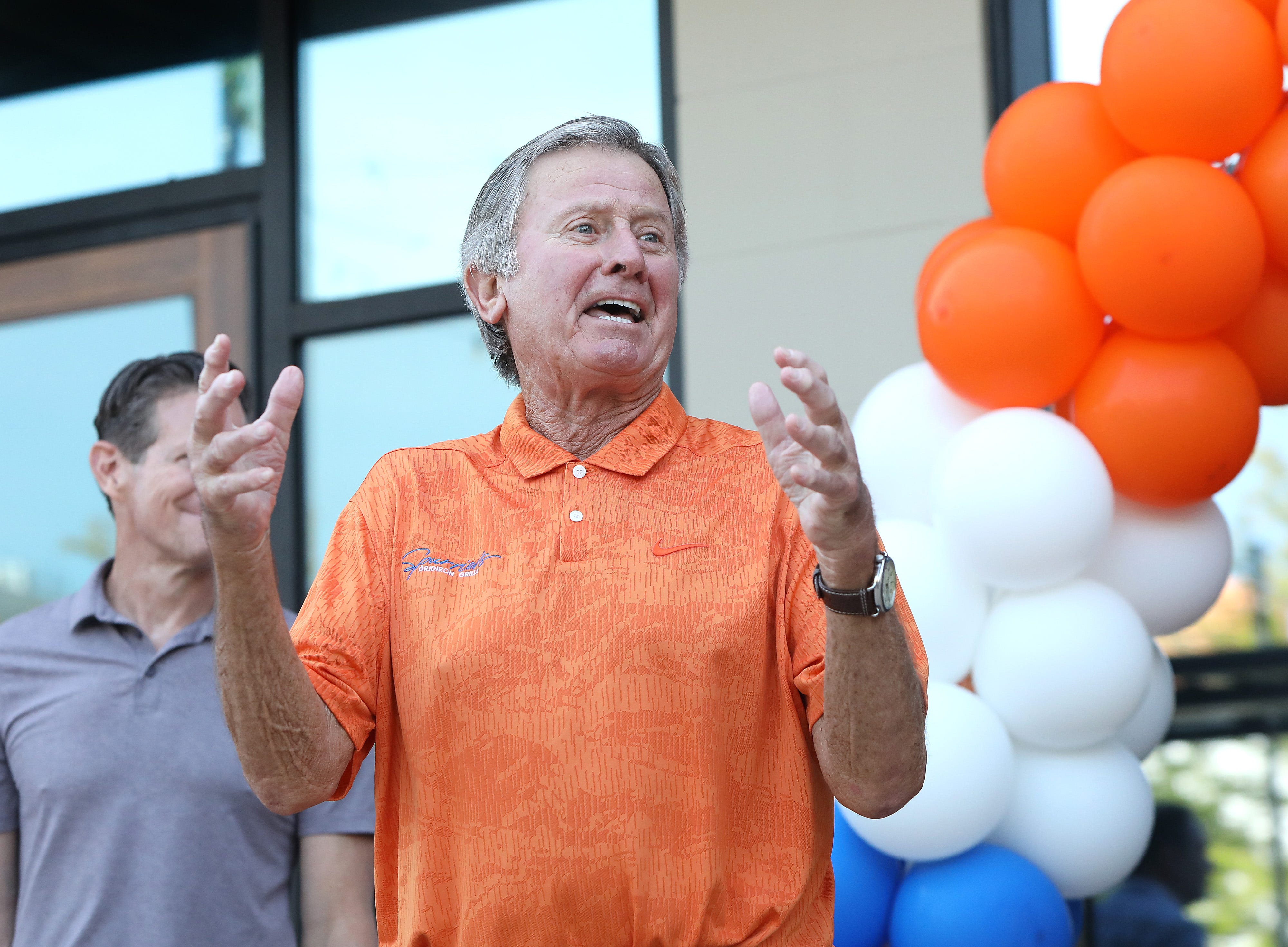 Legendary Florida Gators head ball coach Steve Spurrier gets animated as he makes comments before a ribbon cutting to officially opening his new restaurant Spurrier's Gridiron Grille in Celebration Pointe, in Gainesville, Fla., Aug. 10, 2021.