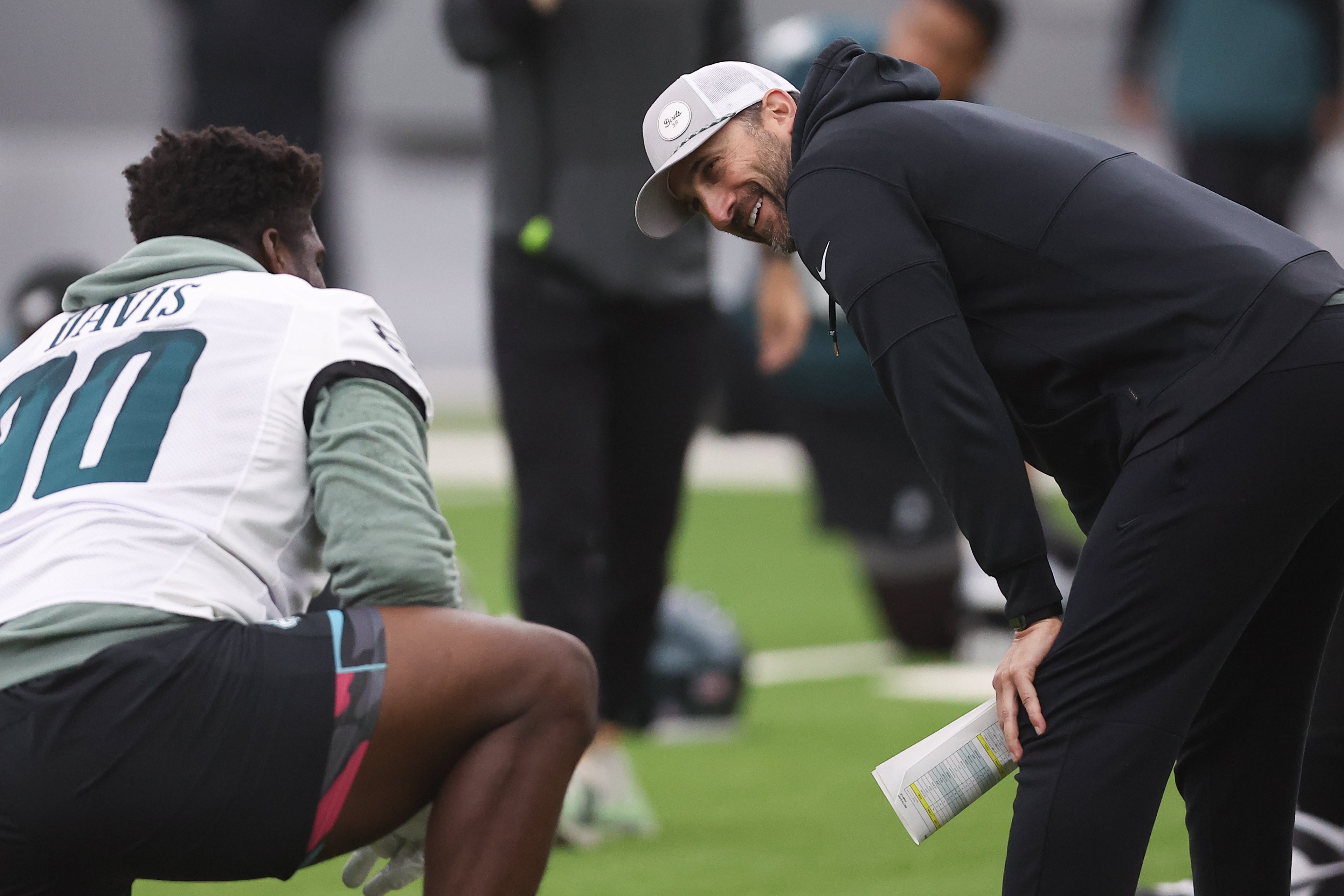 Philadelphia Eagles head coach Nick Sirianni talks with defensive tackle Jordan Davis (90) during OTAs at NovaCare Complex.