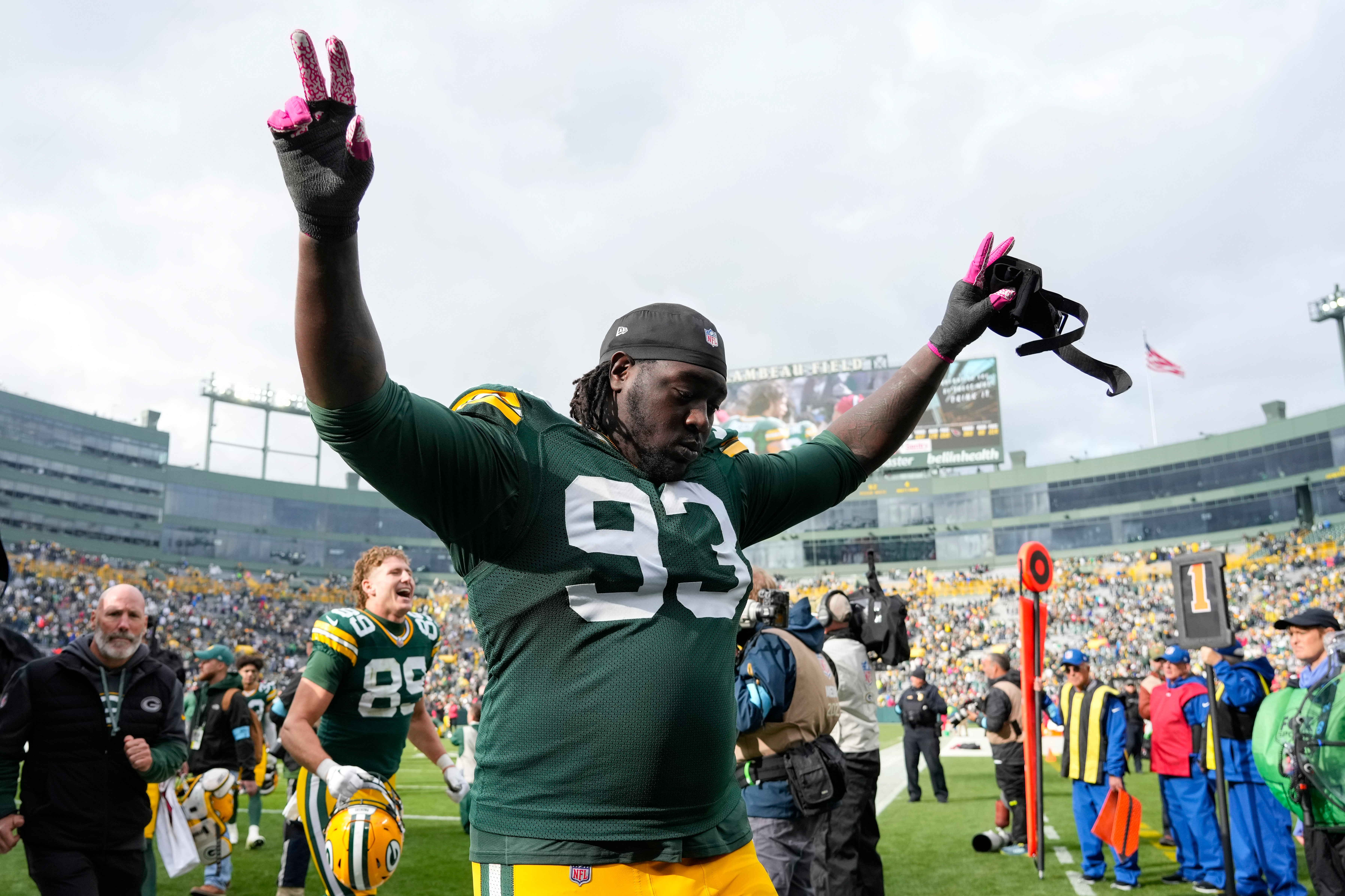Oct 13, 2024; Green Bay, Wisconsin, USA; Green Bay Packers defensive lineman T.J. Slaton (93) celebrates following the game against the Arizona Cardinals at Lambeau Field.