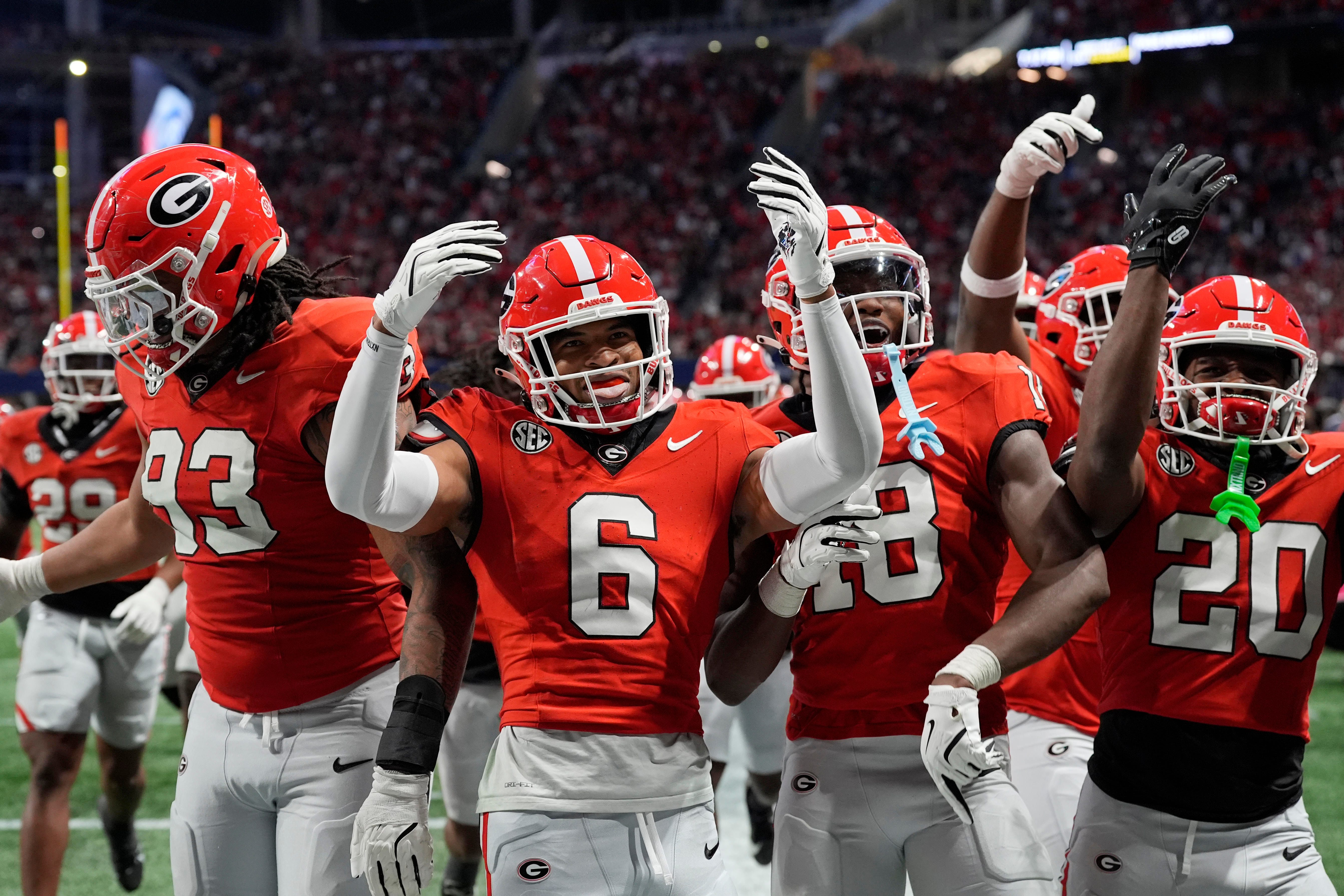 Georgia defensive back Daylen Everette (6) celebrates with his teammates after an interception against Texas during the second half of the 2024 SEC championship game at Mercedes-Benz Stadium in Atlanta.
