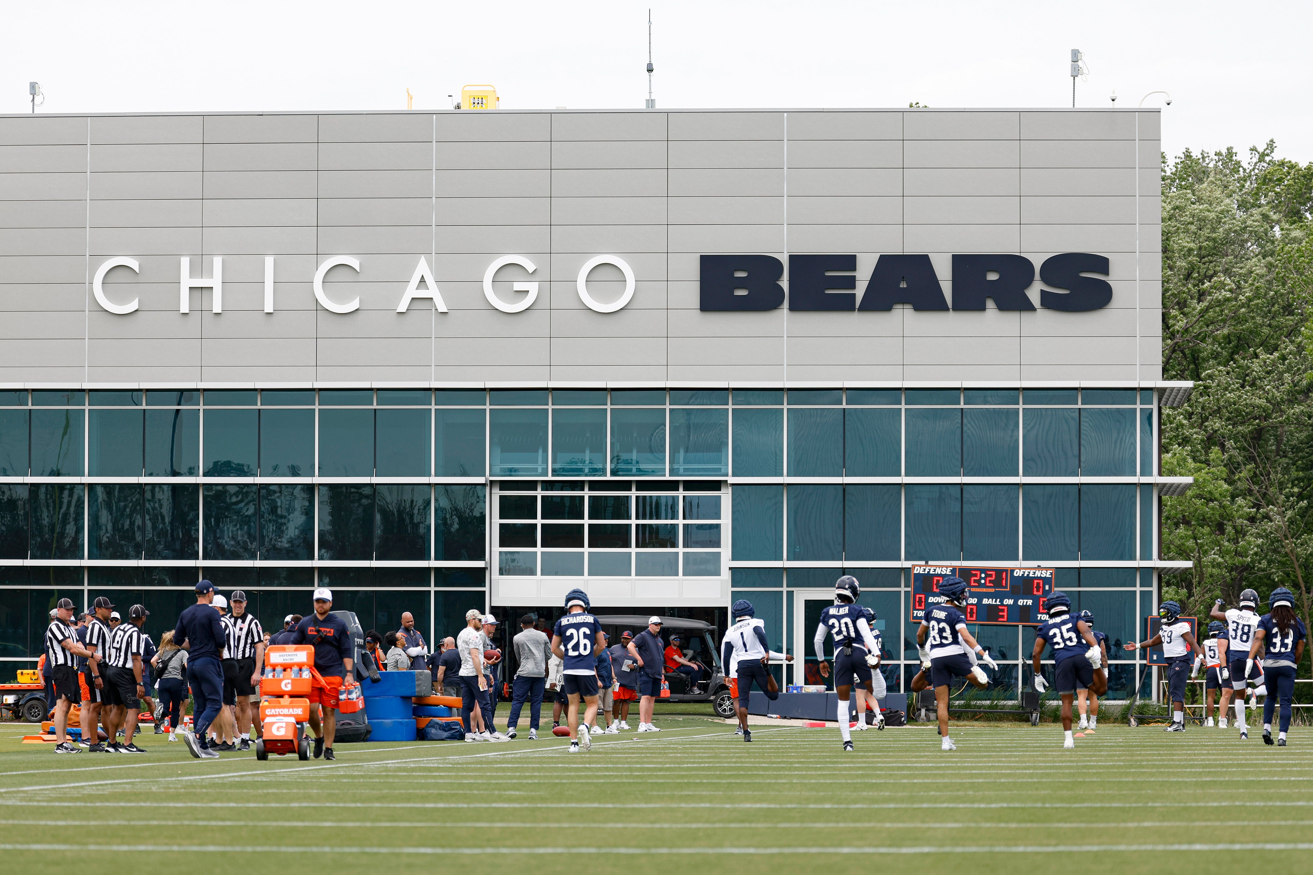 Jun 3, 2025; Lake Forest, IL, USA; Chicago Bears players warm up during minicamp at Halas Hall.