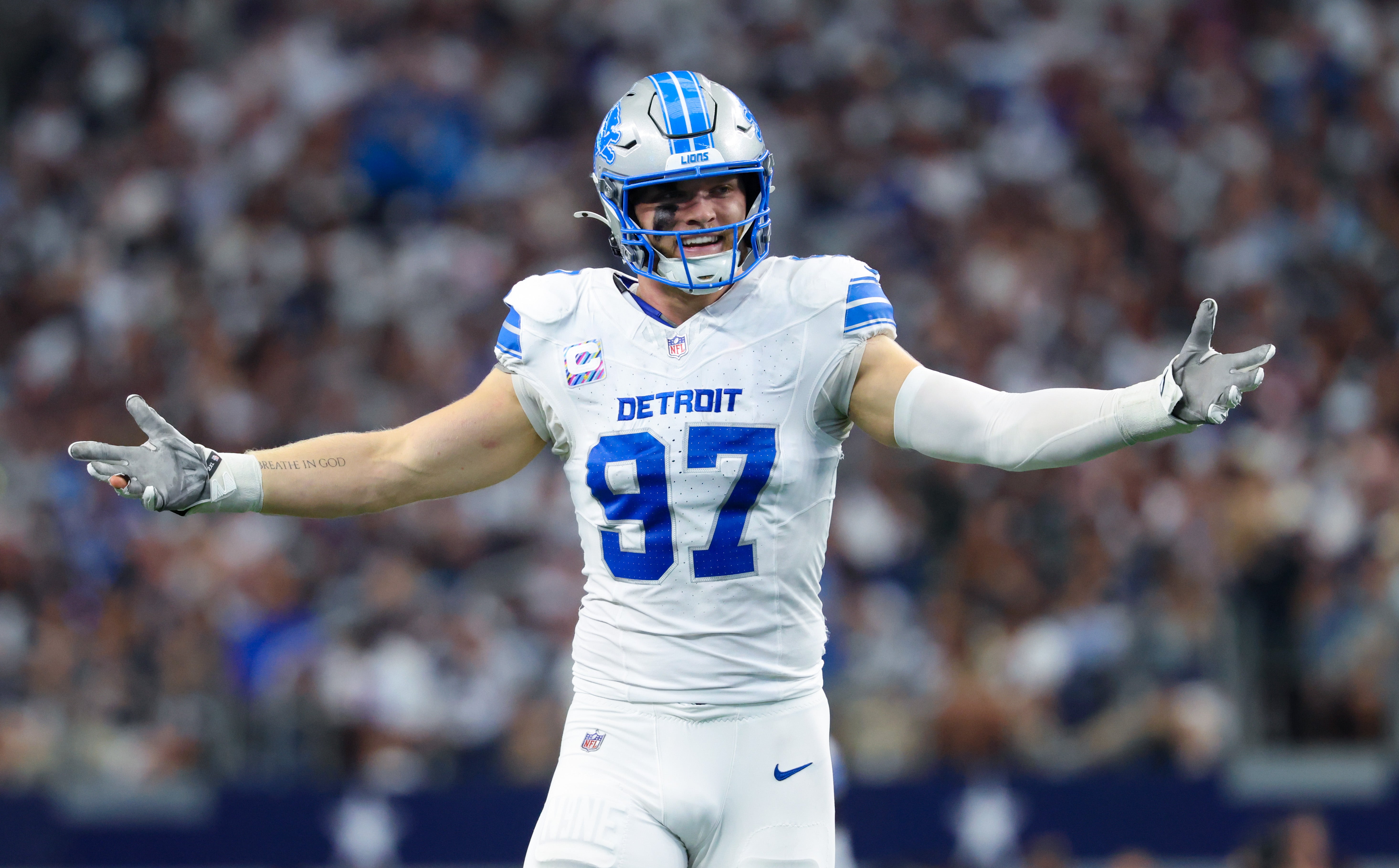Oct 13, 2024; Arlington, Texas, USA; Detroit Lions defensive end Aidan Hutchinson (97) reacts during the second quarter against the Dallas Cowboys at AT&T Stadium.