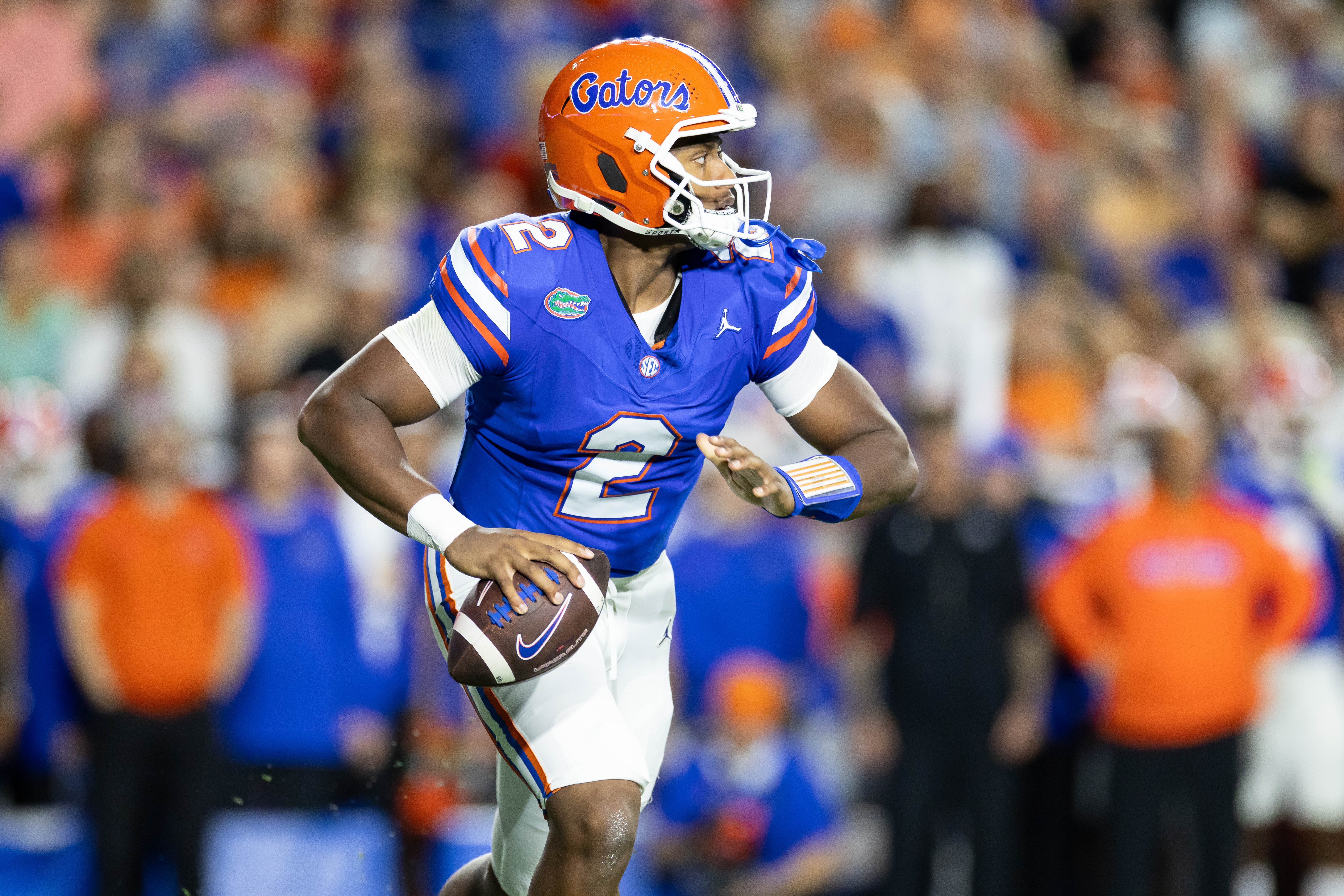 Oct 19, 2024; Gainesville, Florida, USA; Florida Gators quarterback DJ Lagway (2) scrambles with the ball against the Kentucky Wildcats during the first half at Ben Hill Griffin Stadium.
