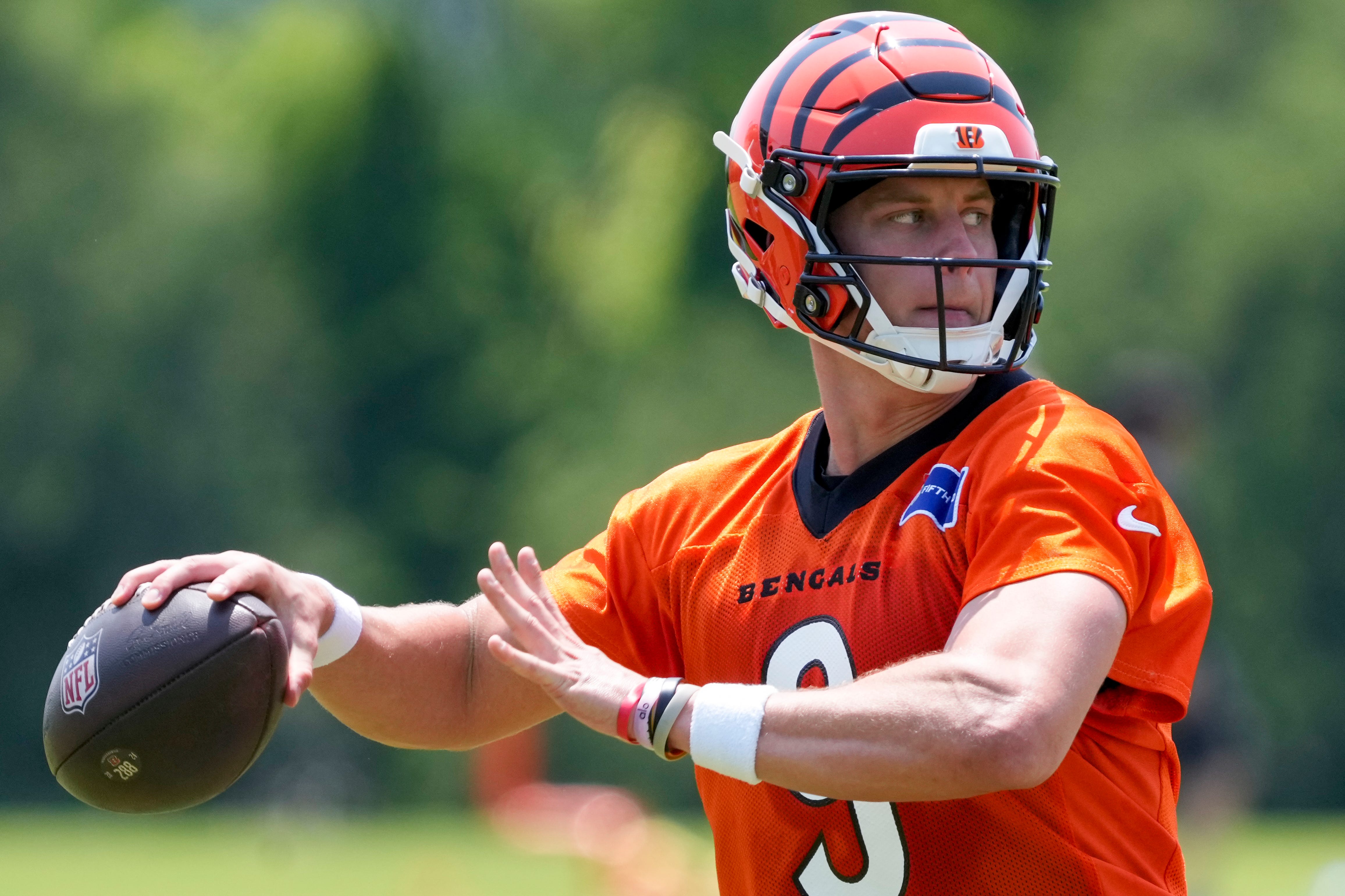 Cincinnati Bengals quarterback Joe Burrow (9) throws a pass during a session of organized team activities on the Bengals practice field at Paycor Stadium in downtown Cincinnati on Tuesday, June 3, 2025.