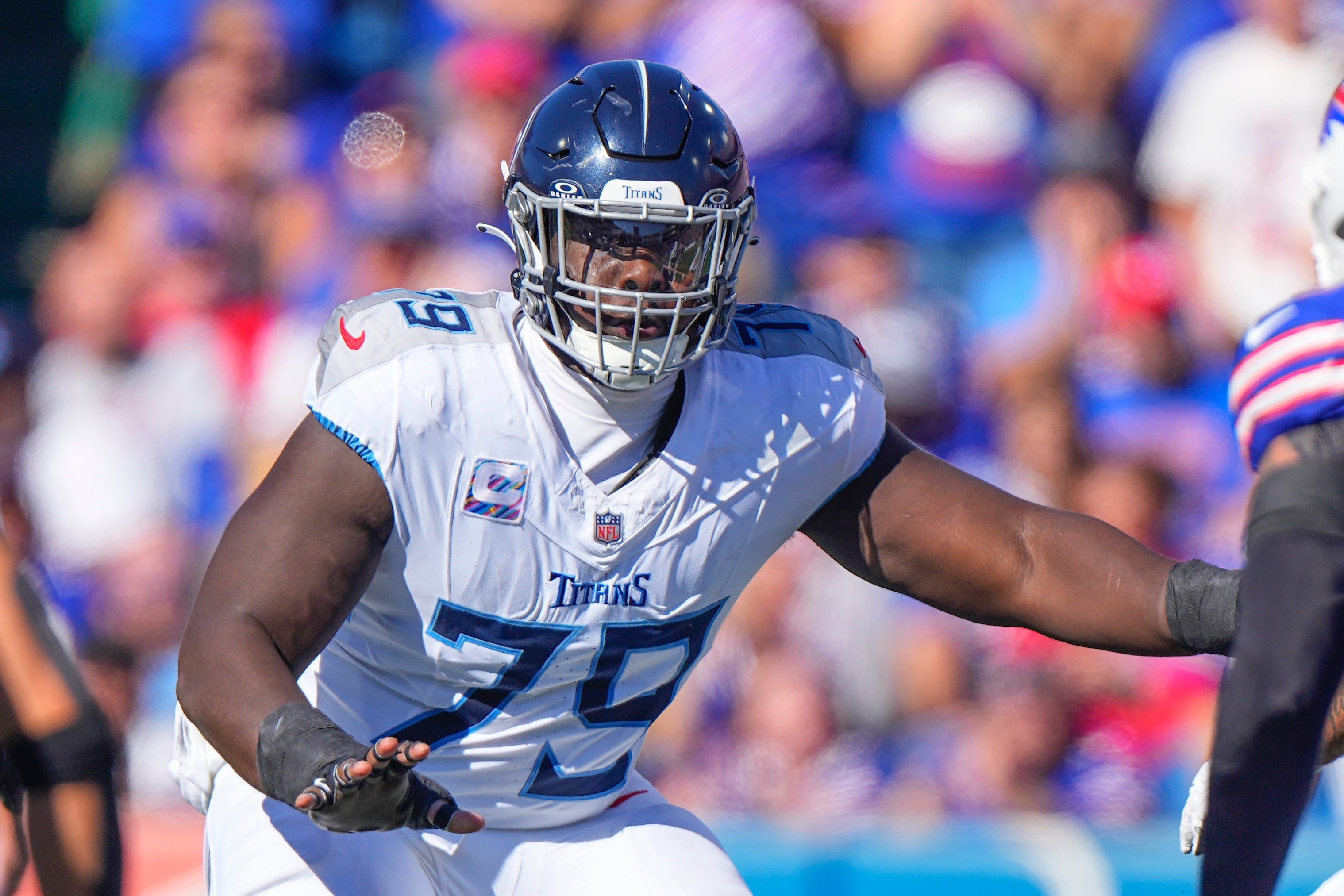 Oct 20, 2024; Orchard Park, New York, USA; Tennessee Titans center Lloyd Cushenberry III (79) looks to block against the Buffalo Bills during the first half at Highmark Stadium. Mandatory Credit: Gregory Fisher-Imagn Images