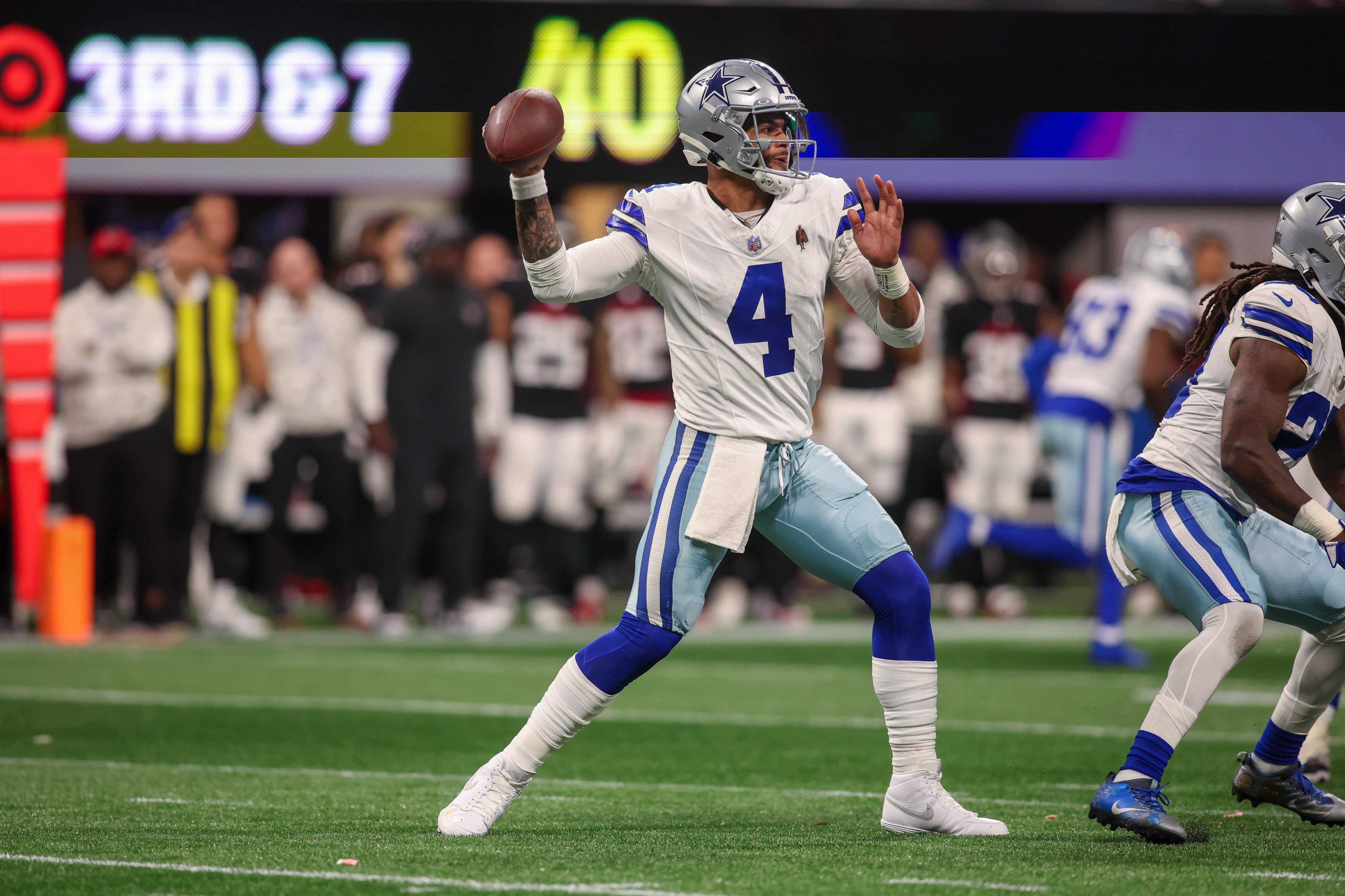 Dallas Cowboys quarterback Dak Prescott (4) throws a pass against the Atlanta Falcons in the third quarter at Mercedes-Benz Stadium.