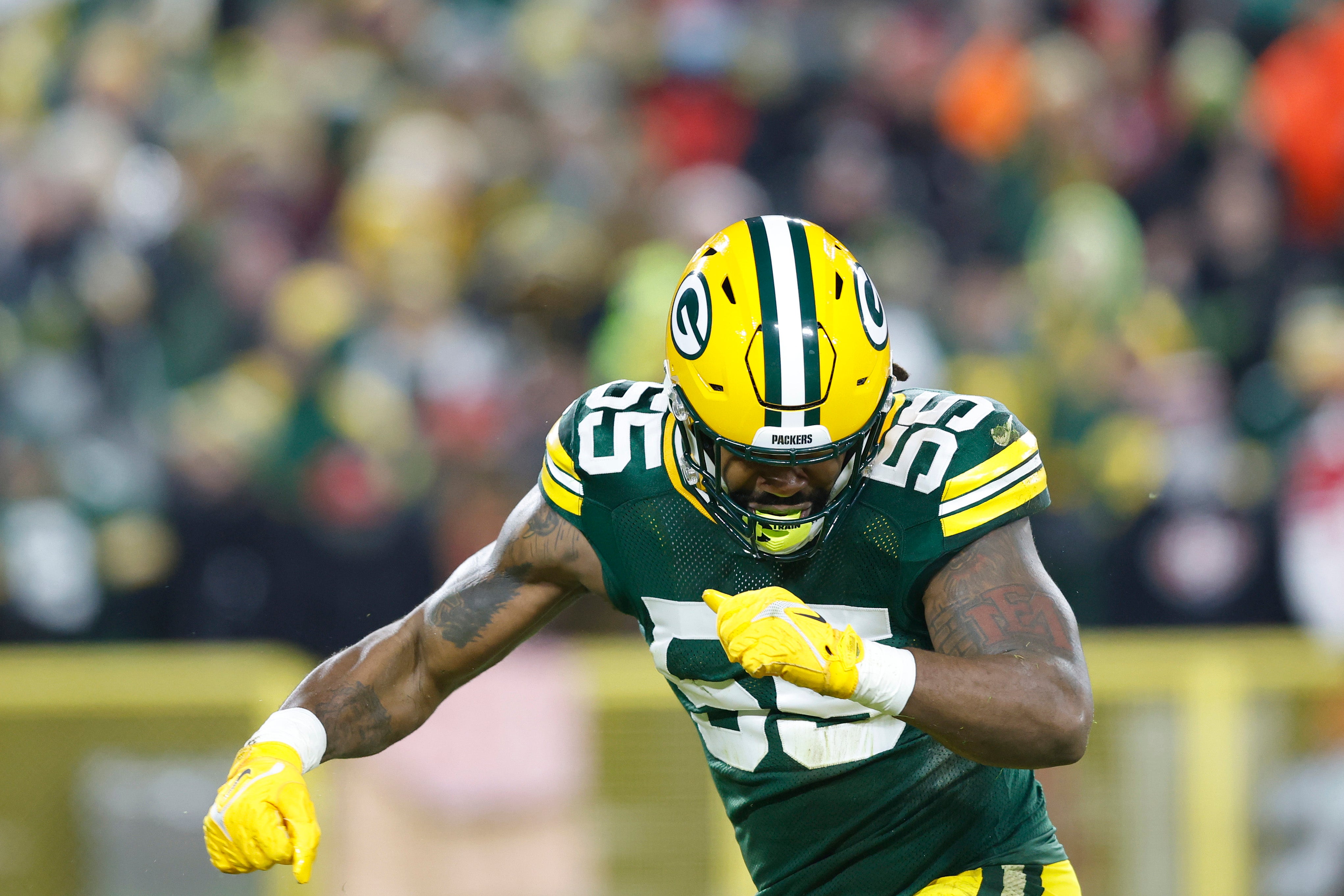 Green Bay Packers outside linebacker Za'Darius Smith (55) celebrates after sacking San Francisco 49ers quarterback Jimmy Garoppolo (not pictured) in the first quarter during a NFC Divisional playoff football game at Lambeau Field.