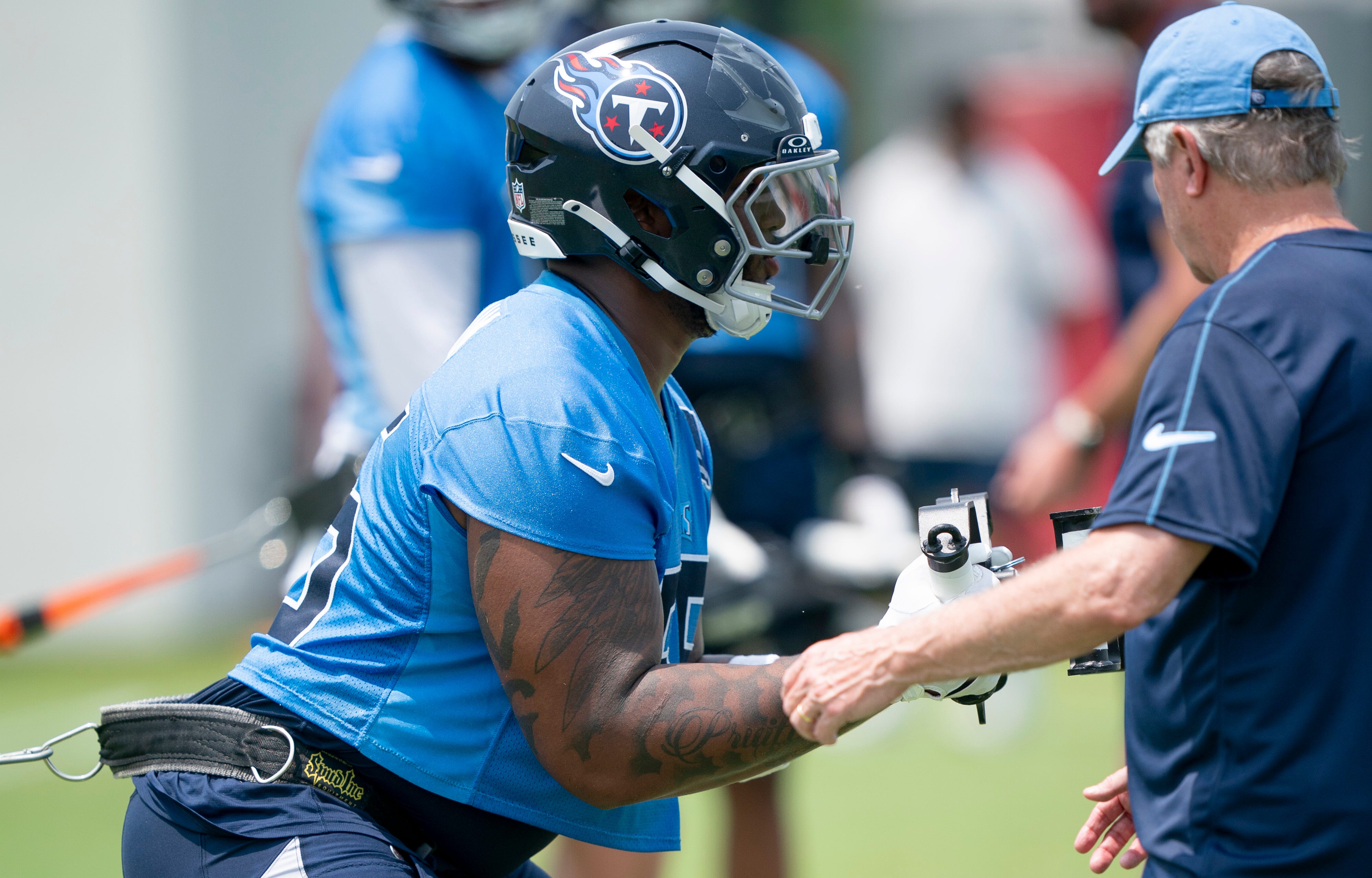 Tennessee Titans tackle JC Latham (55) goes through drills during mandatory Titans Minicamp at Ascension Saint Thomas Sports Park in Nashville, Tenn., Tuesday, June 10, 2025.